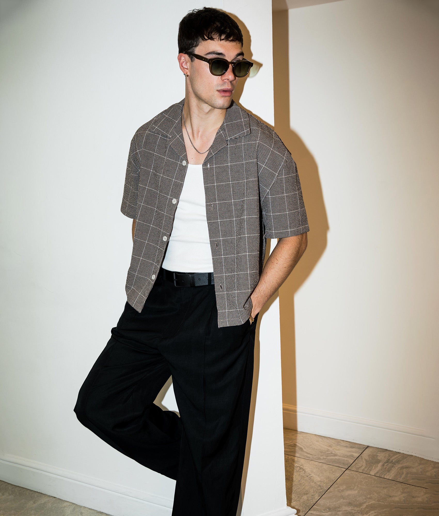 MKI MIYUKI ZOKU Box Fit Linen Short Sleeve Vacation Shirt in Brown at EQVVS Menswear. Campaign shot.