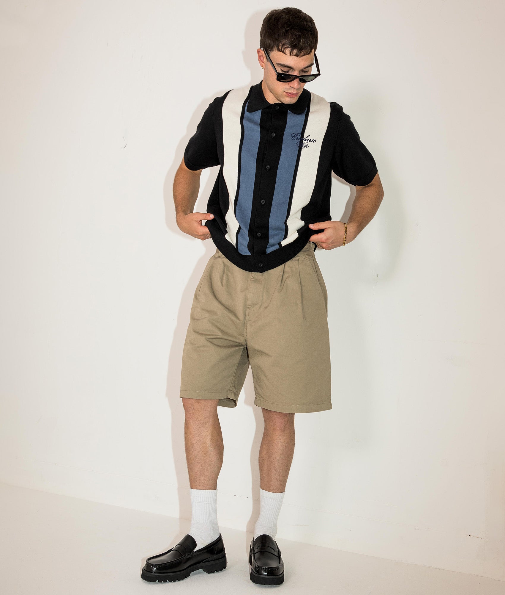 Carhartt WIP Marv Shorts in Stone Washed Iroko at EQVVS Menswear. Campaign shot.