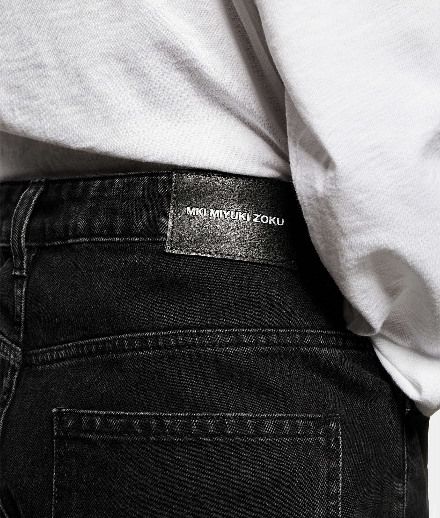 MKI MIYUKI ZOKU Denim Classic Jeans in Black Wash at EQVVS Menswear. Detail shot.