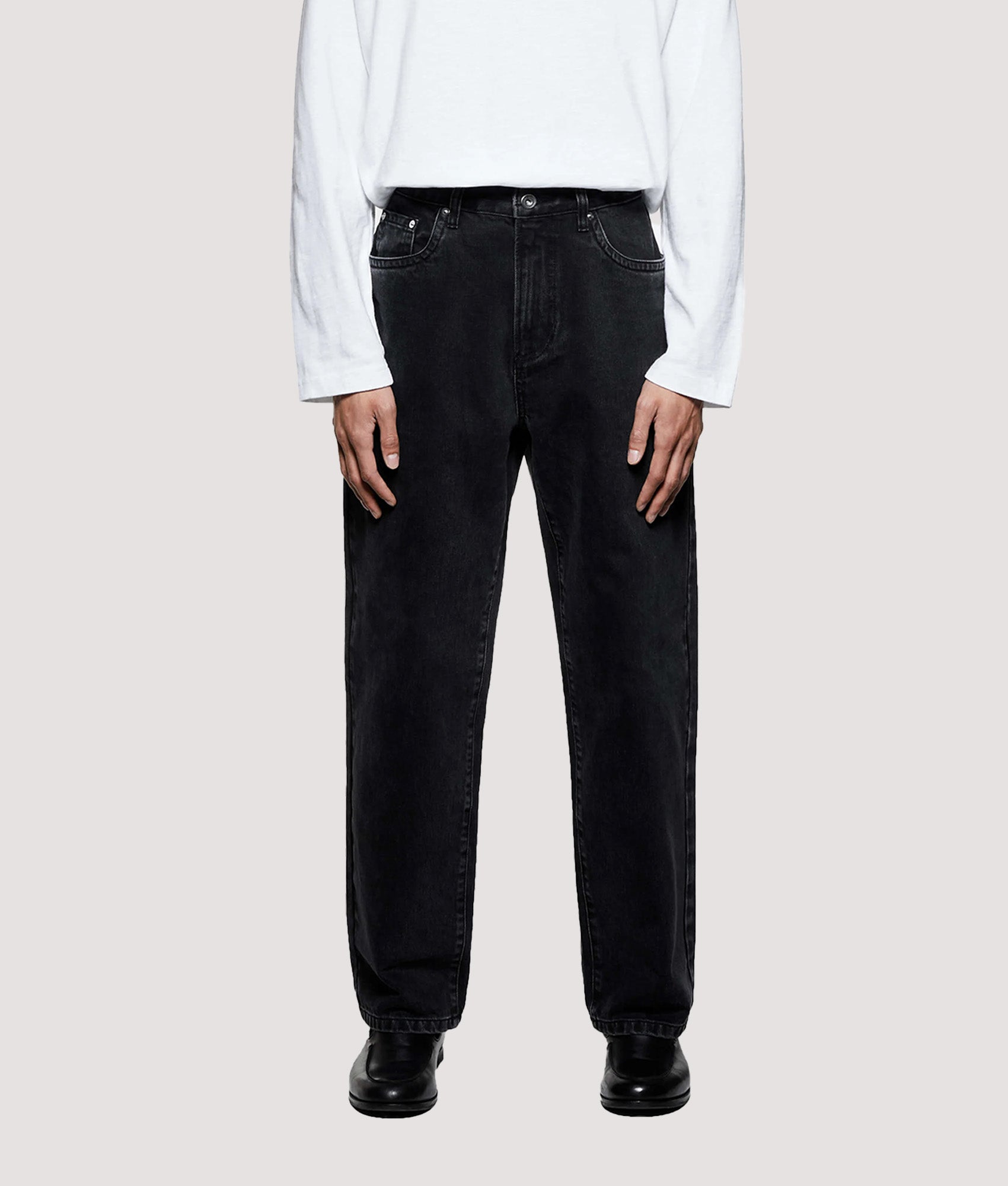 MKI MIYUKI ZOKU Denim Classic Jeans in Black Wash at EQVVS Menswear. Model front shot.