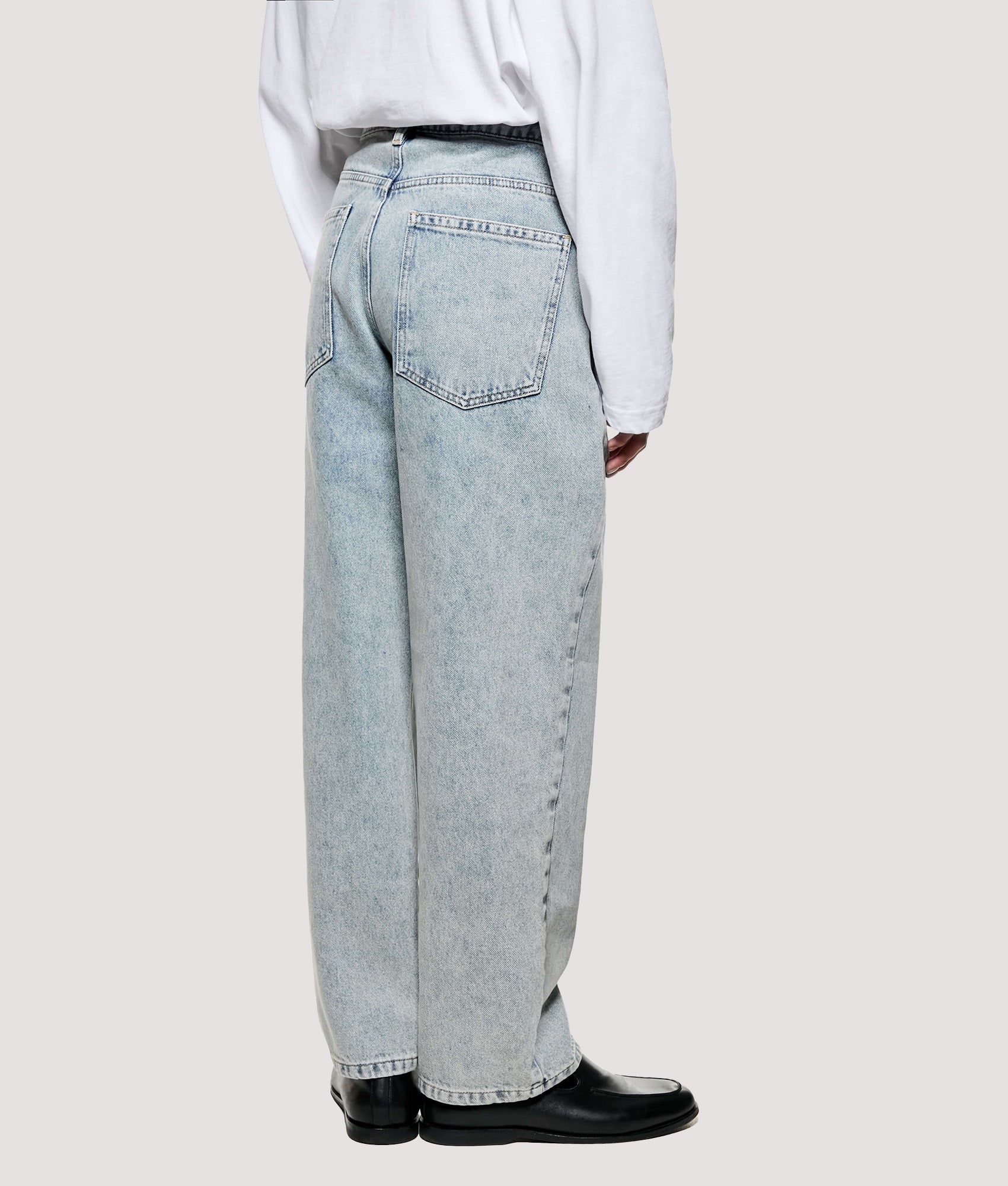 MKI MIYUKI ZOKU Denim Classic Jeans return in Bleach Wash at EQVVS Menswear. Angled model back shot.