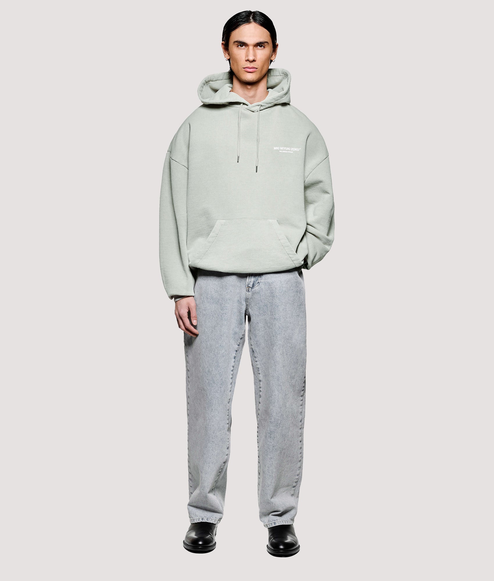 MKI MIYUKI ZOKU Box Fit Design Studio Hoodie in Pigment Cement at EQVVS Menswear. Mode front shot.
