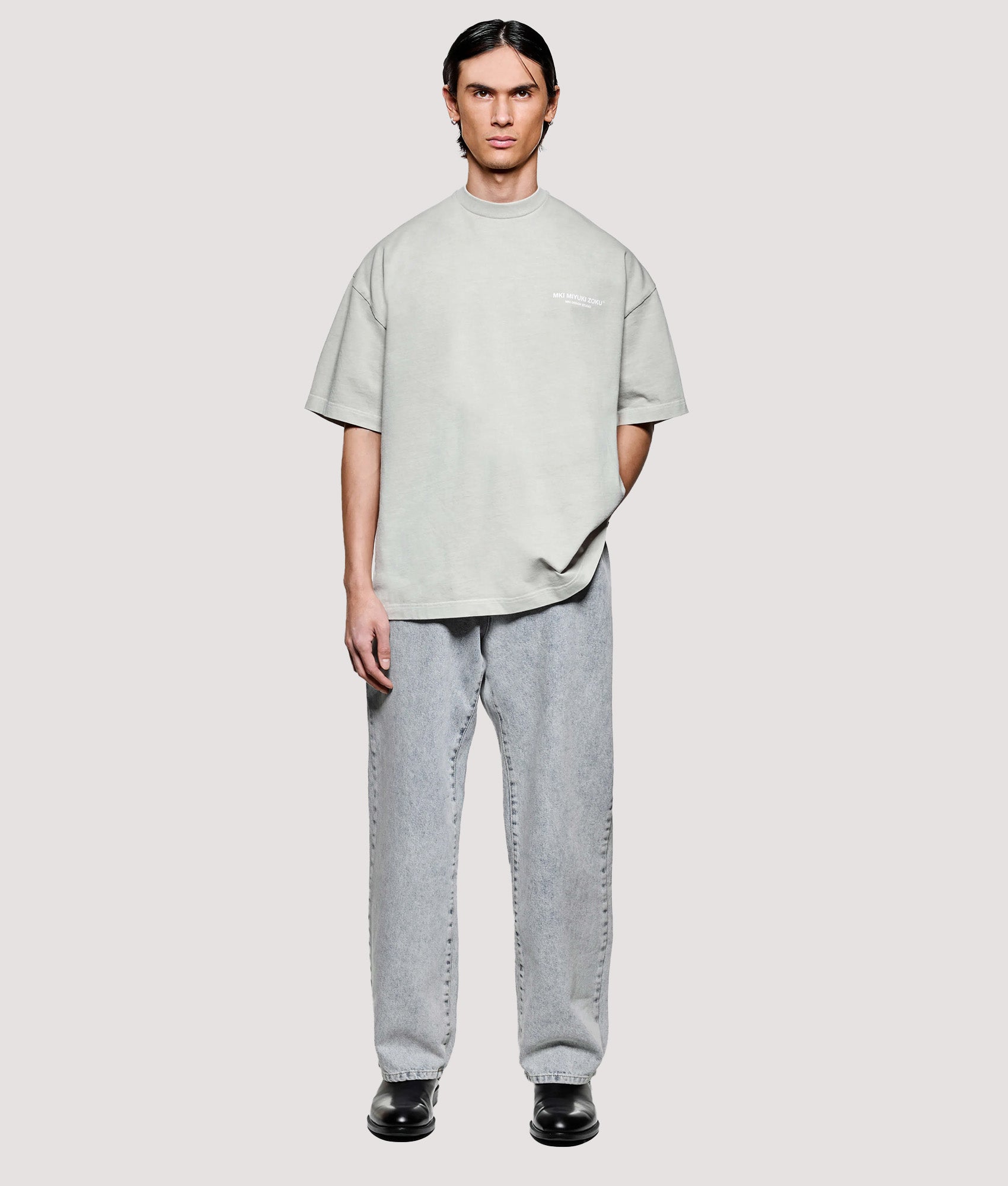 MKI MIYUKI ZOKU Box Fit Design Studio T-Shirt in Pigment Cement at EQVVS Menswear. Model full front shot.