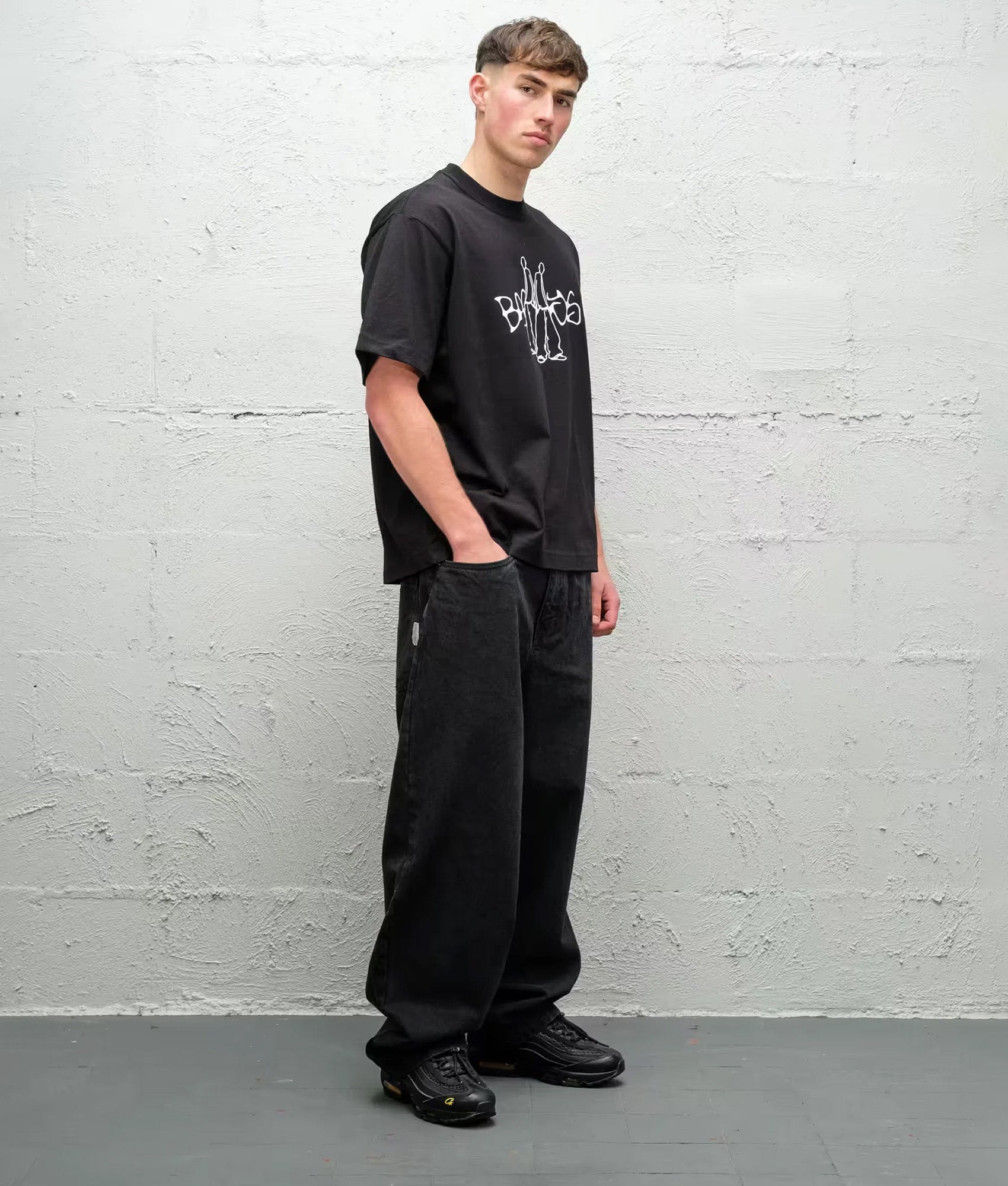 Baggys Baggy Denim Pants in Pitch Black at EQVVS Menswear. Model angled front shot.