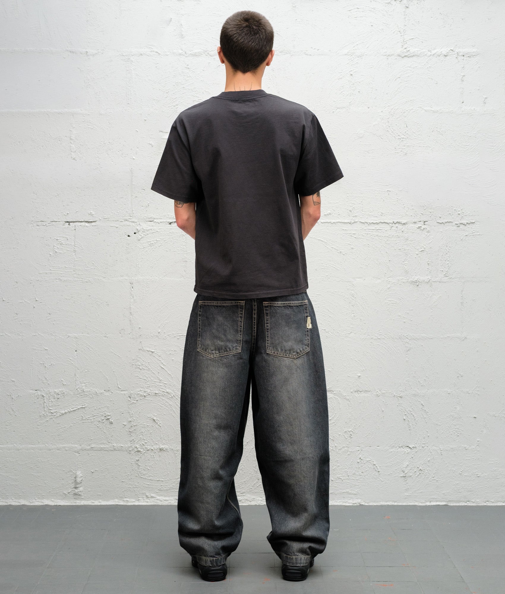 Baggys Baggy Denim Pants in Flint Grey at EQVVS Menswear. Model back shot.