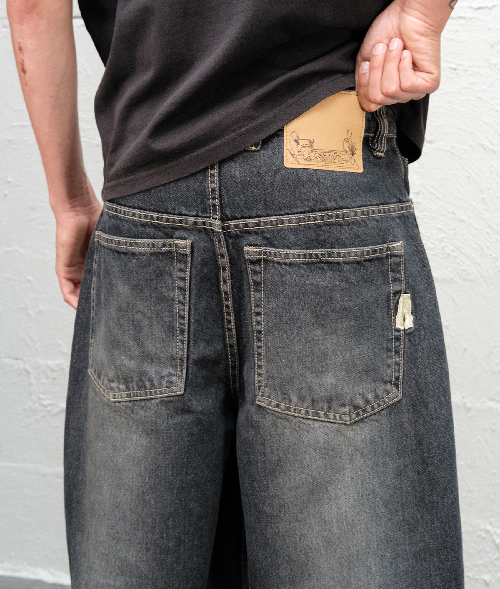 Baggys Baggy Denim Pants in Flint Grey at EQVVS Menswear. Rear detail shot.