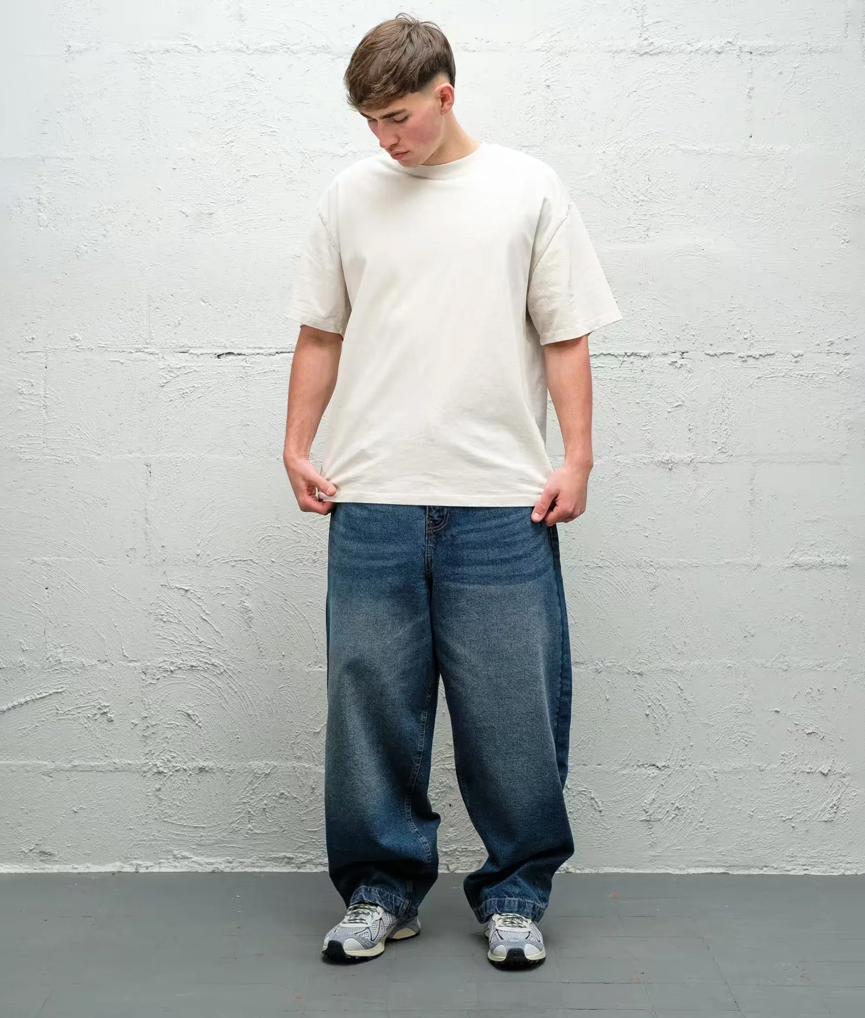 Baggys Baggy Denim Pants season in  Frost at EQVVS Menswear. Model front shot.