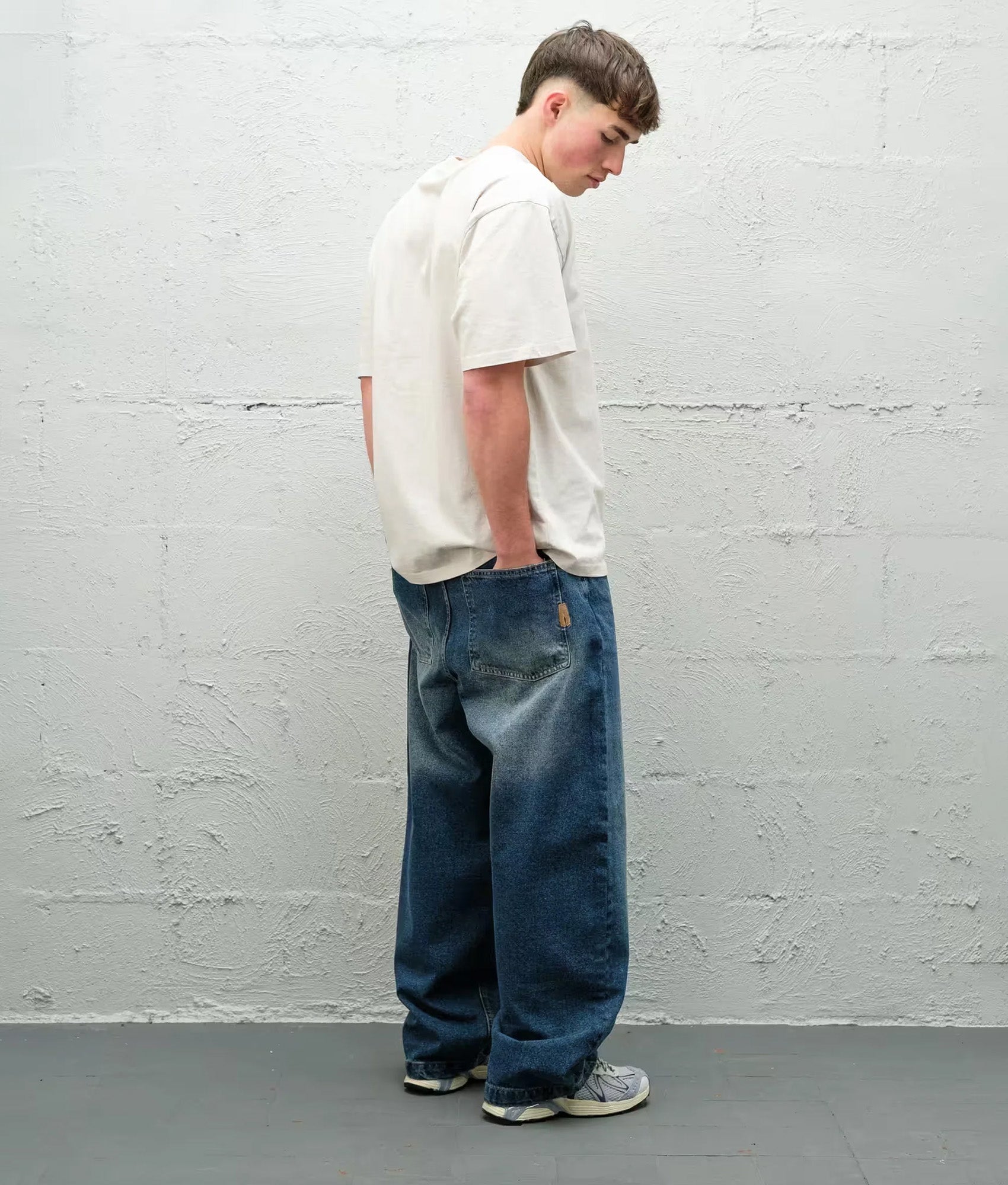 Baggys Baggy Denim Pants season in  Frost at EQVVS Menswear. Moel back shot.