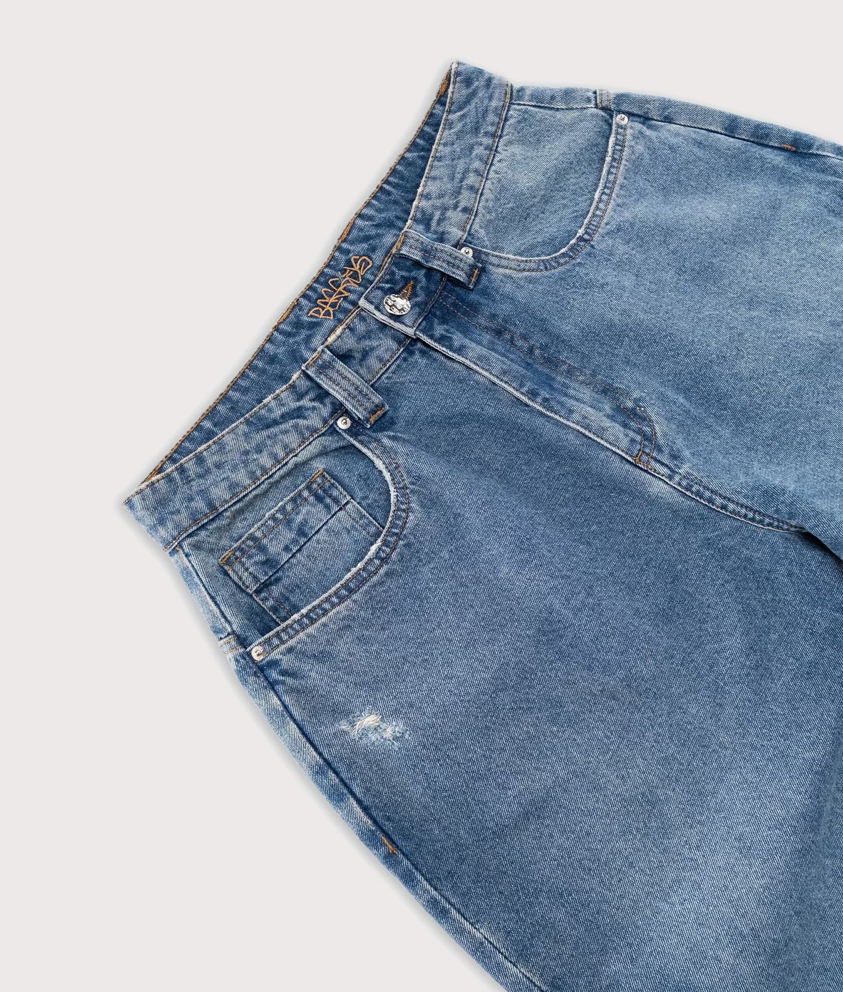 Baggys Baggy Denim Pants in Light Washed Fray at EQVVS Menswear. Detail shot.