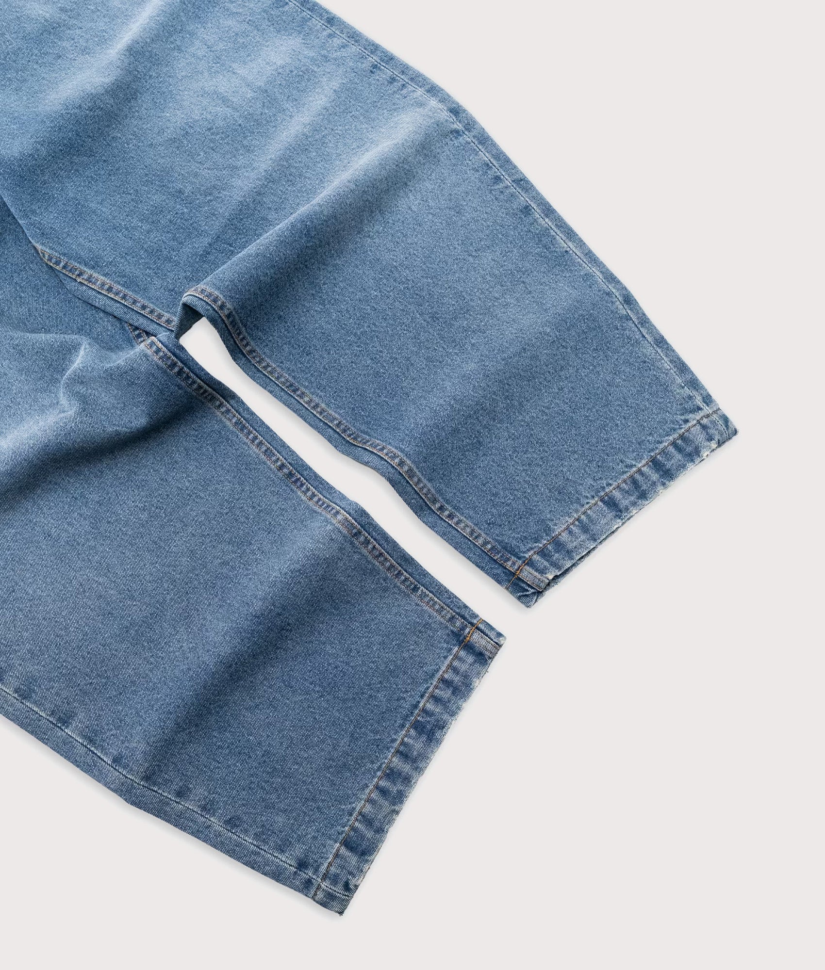 Baggys Baggy Denim Pants in Light Washed Fray at EQVVS Menswear. Detail shot.