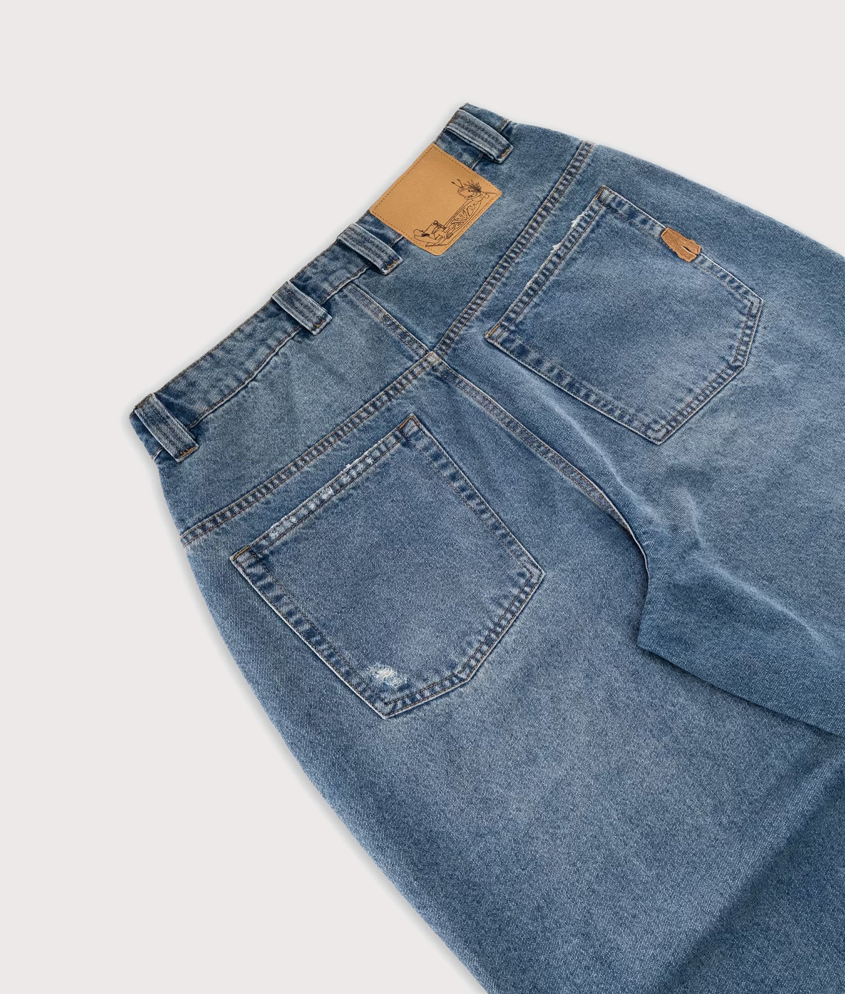 Baggys Baggy Denim Pants in Light Washed Fray at EQVVS Menswear. Back detail shot.