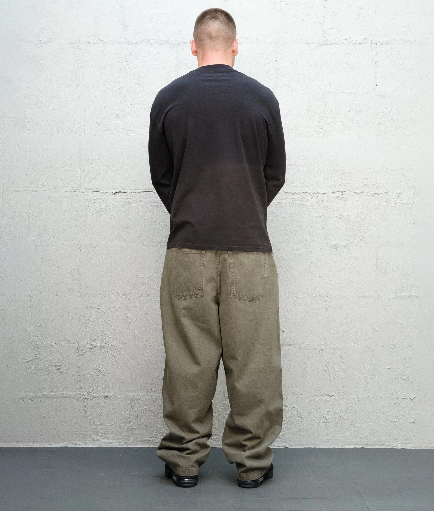 Baggys Baggy Denim Pants in Sage at EQVVS Menswear. Back shot.