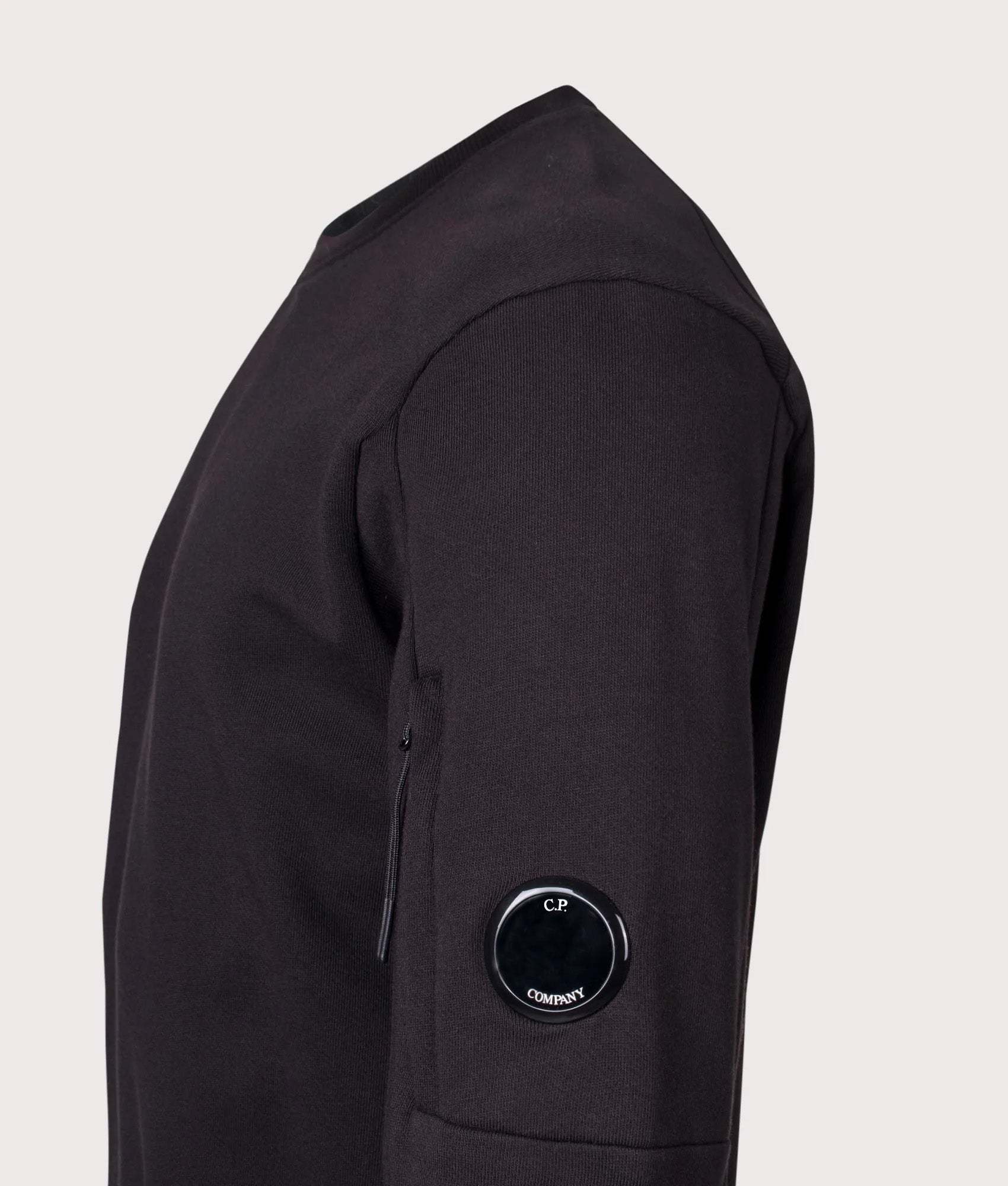 Diagonal Raised Fleece Lens Sweatshirt in Black | 100% Cotton | C.P. Company | EQVVS | Side angle shot 