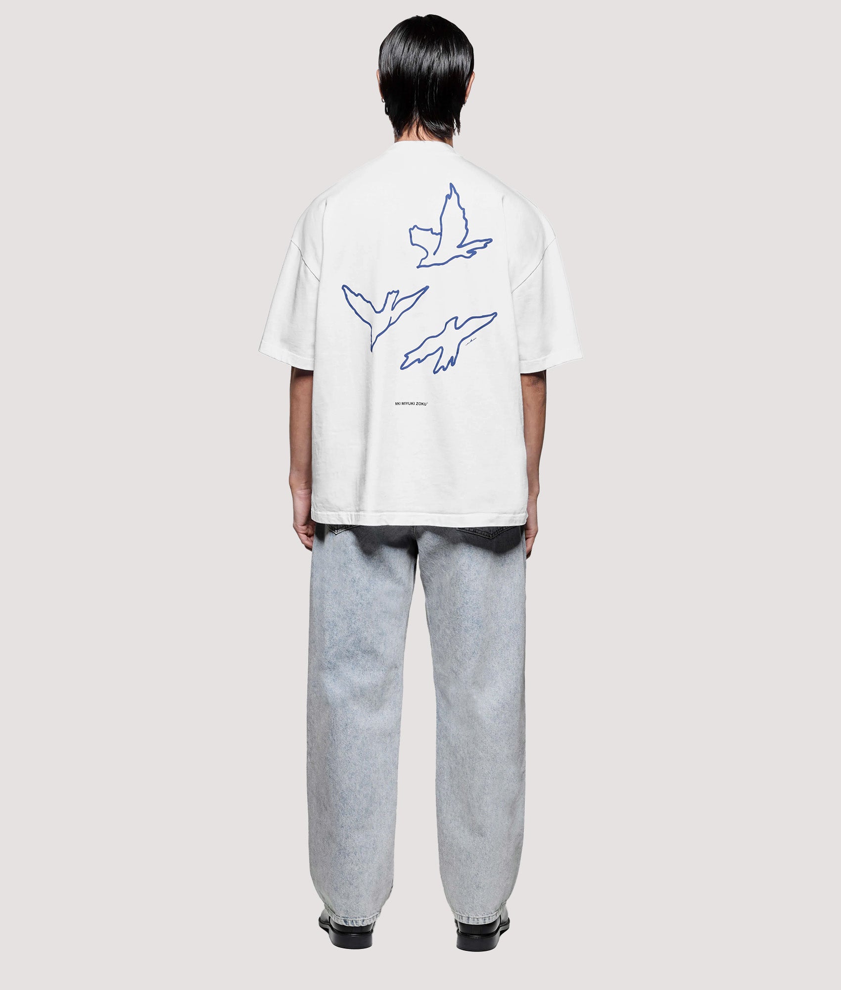 MKI MIYUKI ZOKU Box Fit Flight T-Shirt in White at EQVVS Menswear. Model Back shot.