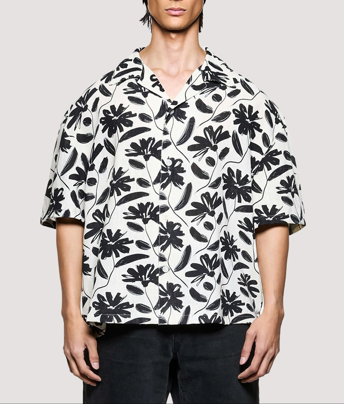 MKI MIYUKI ZOKU Box Fit Floral Linen Short Sleeve Vacation Shirt in Raw at EQVVS Menswear. Model front shot. 