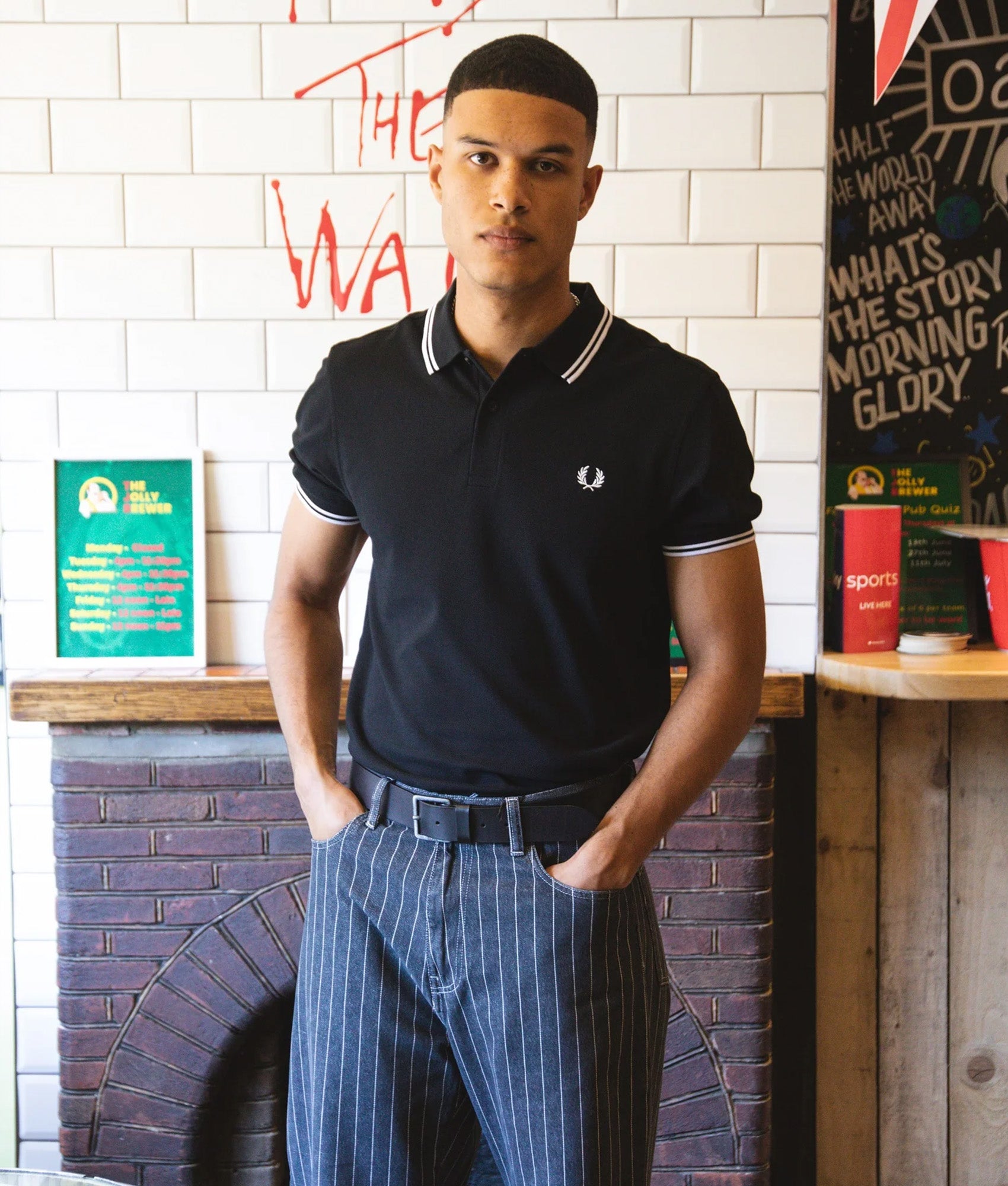 Fred Perry Twin Tipped Polo Shirt in Night Green and Snow White at EQVVS Menswear. Campaign shoty