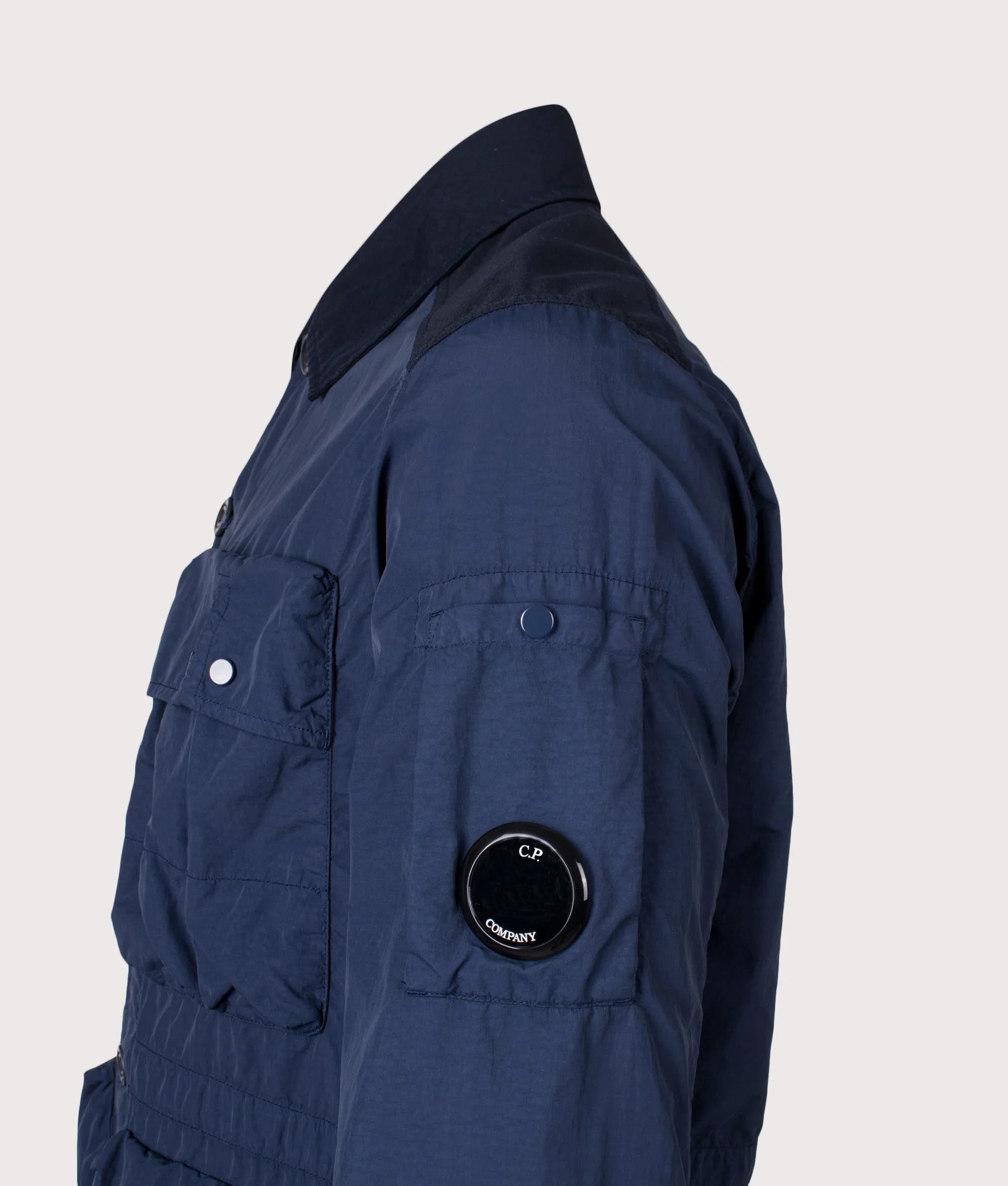 C.P. Company Flatt Nylon Mixed Button Lens Jacket in Midnight Navy at EQVVS Menswear. Lens detail shot.