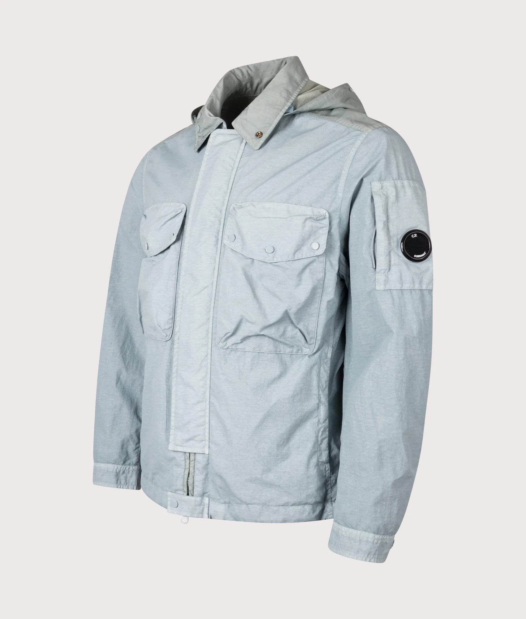 C.P. Company Flatt Nylon Mixed Goggle Overshirt in Silver blue at EQVVS Menswear. Angled front shot.