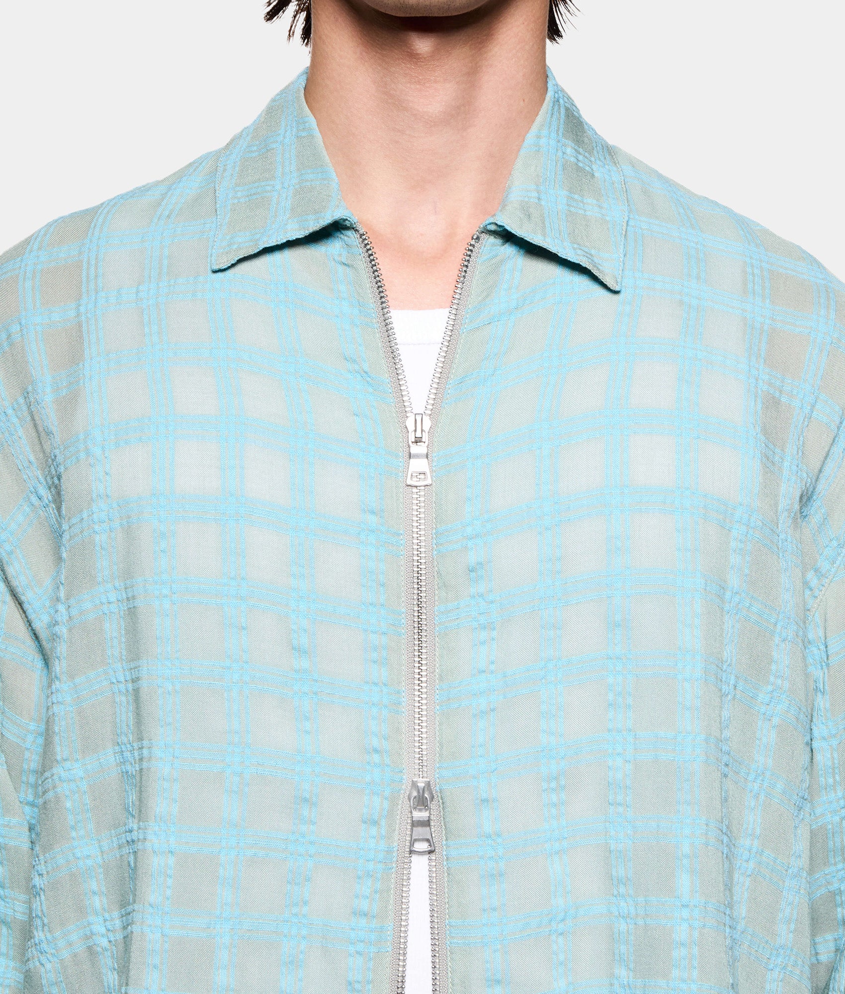 MKI MIYUKI ZOKU Box Fit Grid Check Rider in Sage at EQVVS Menswear. Second detail shot.