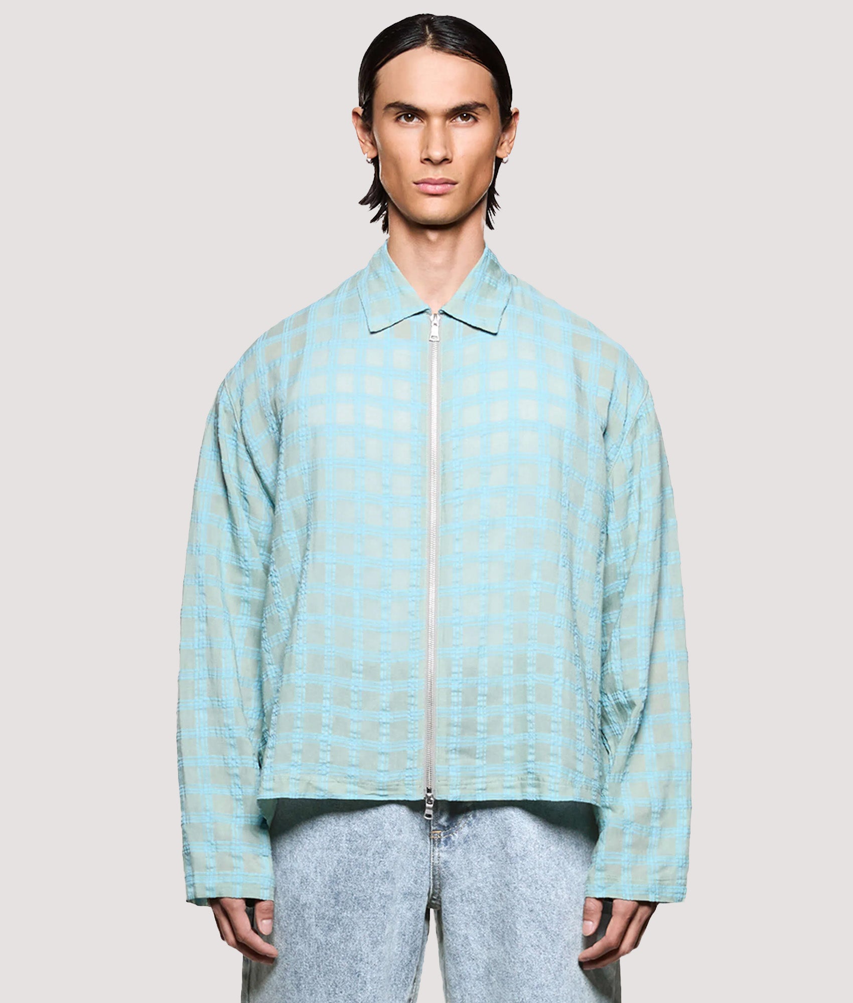 MKI MIYUKI ZOKU Box Fit Grid Check Rider in Sage at EQVVS Menswear. Model front shot.