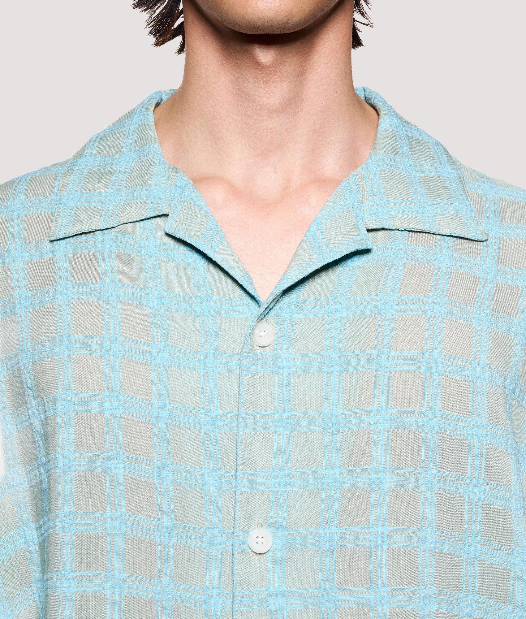 MKI MIYUKI ZOKU Box Fit Grid Check Short Sleeve Vacation Shirt in sage at EQVVS Menswear. Second detail shot.
