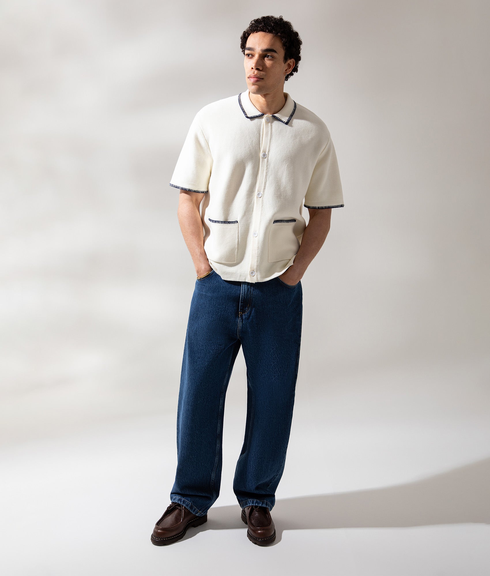 Service Works Blanket Stitch Short Sleeve Knitted Shirt in Off White at EQVVS Menswear. Campaign Shot.
