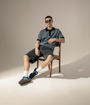 Wax London Turin Polo Shirt in Navy at EQVVS. Campaign Image Angled.