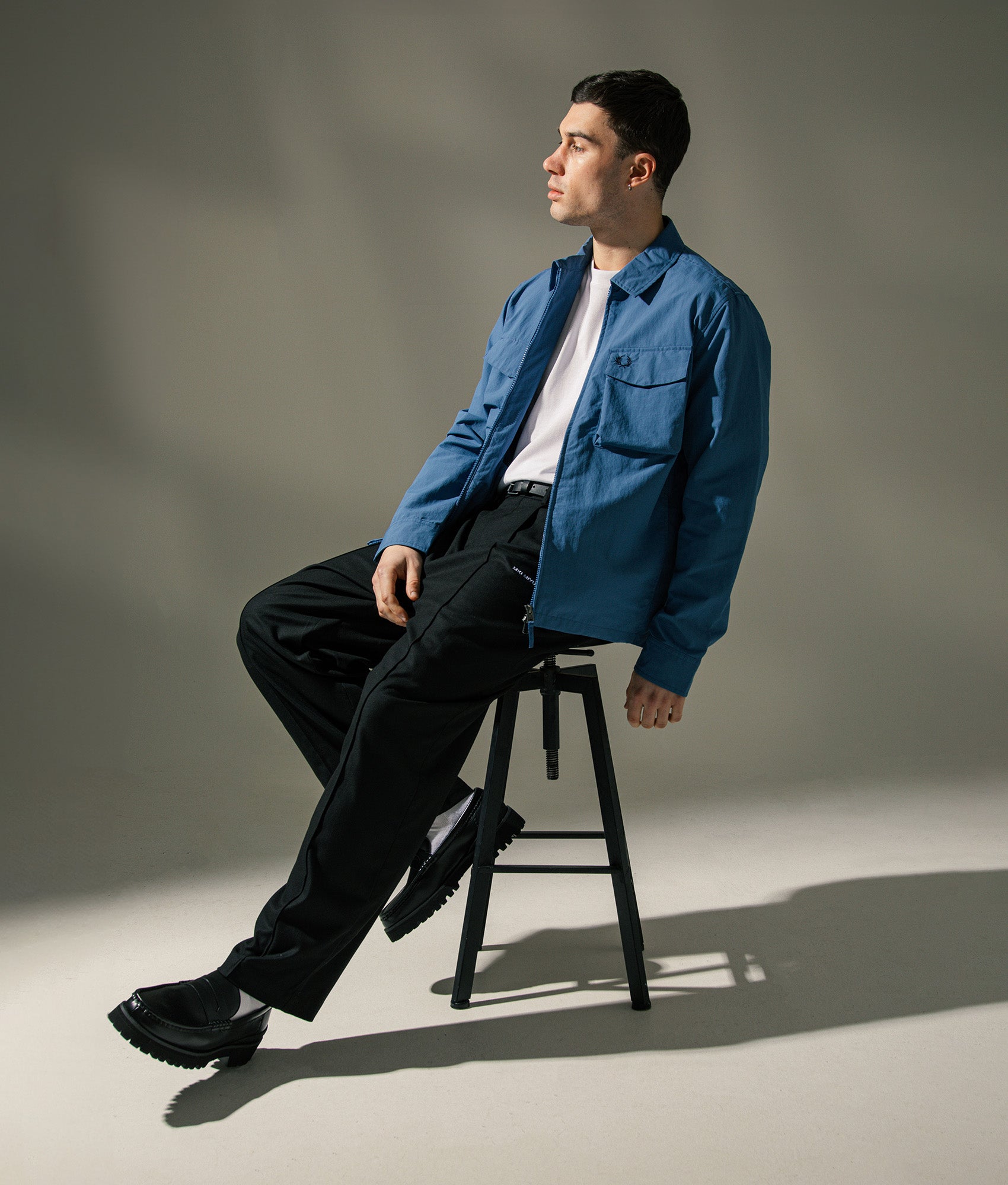 Fred Perry Ripstop Pocket Overshirt in Ace Blue at EQVVS Menswear. Campaign shot.