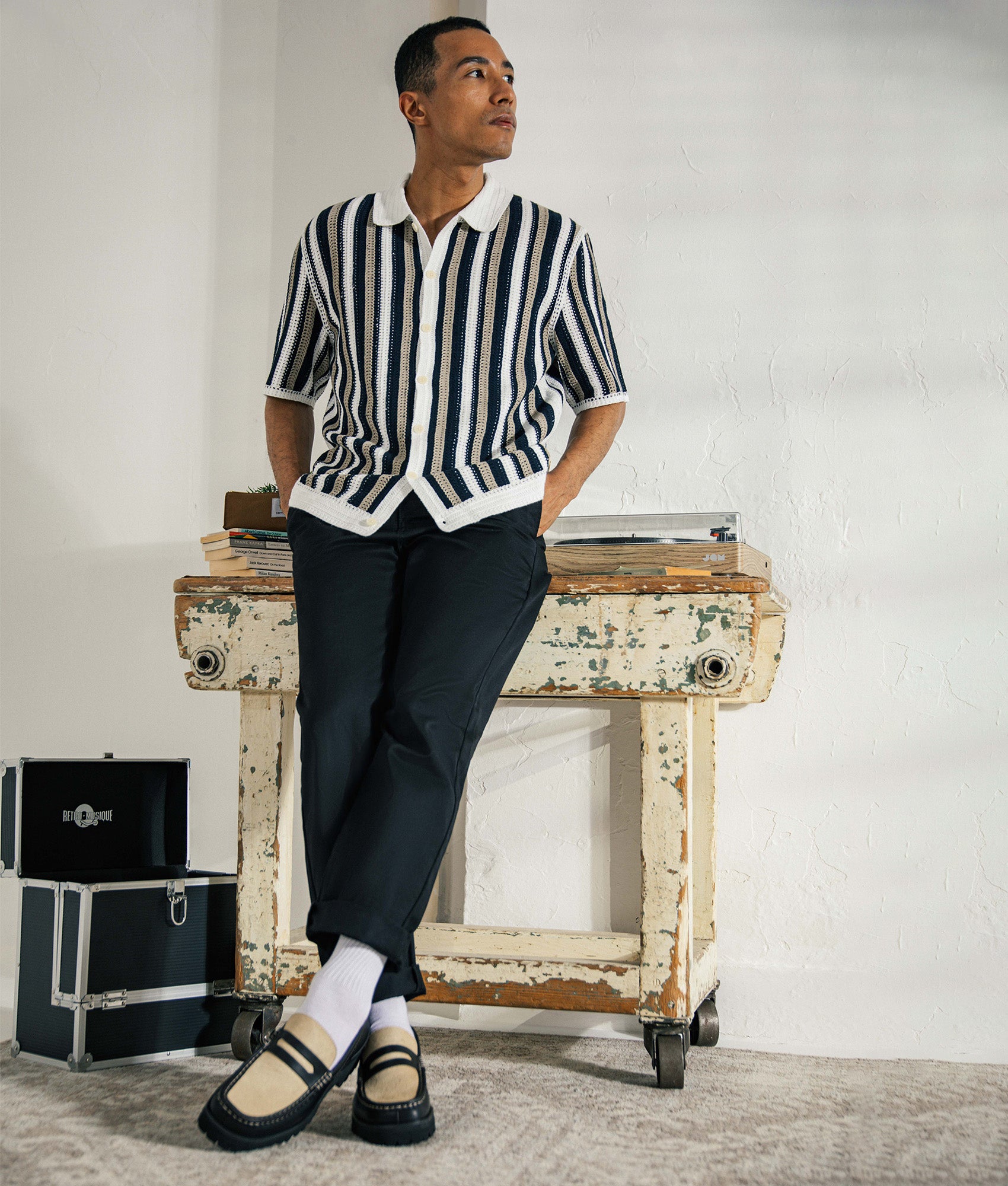 Wax London Porto Stripe Crochet Polo Shirt in Ecru and Black at EQVVS menswear. Campaign shot.