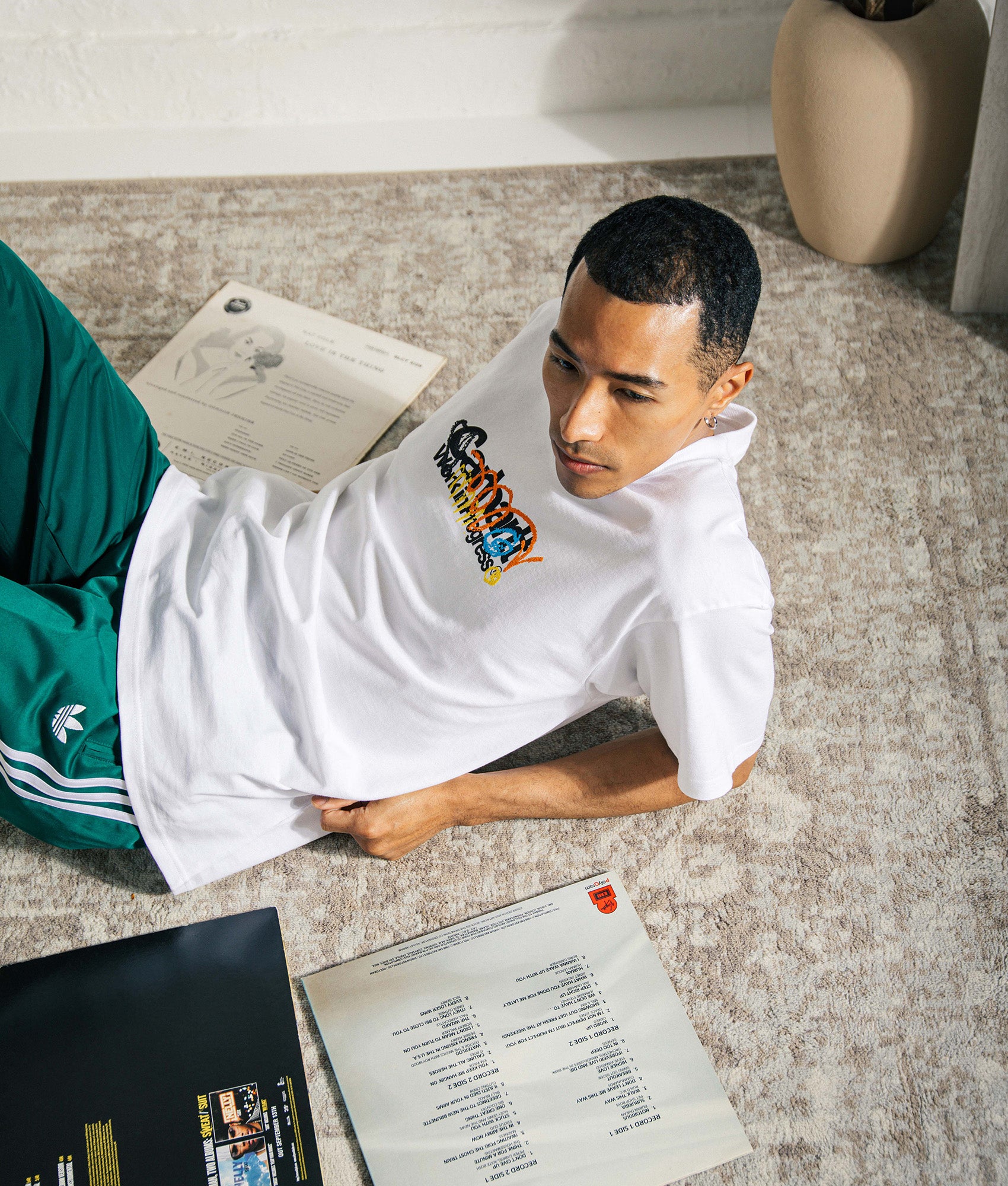 Carhartt WIP Relaxed Fit Primary T-Shirt  in White at EQVVS Menswear. Campaign shot.