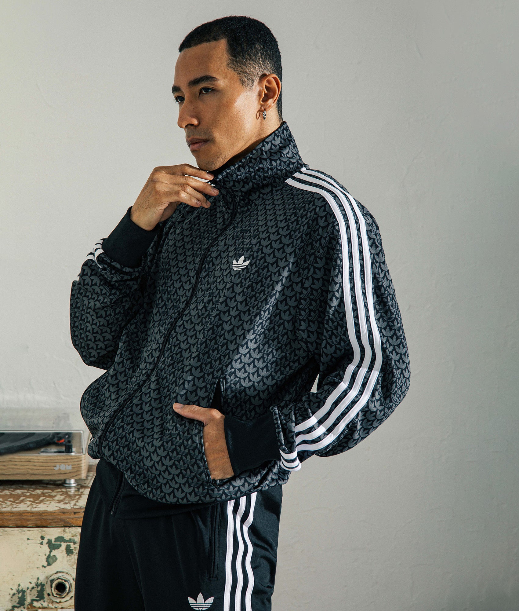 adidas Originals Firebird Monogram Track Top in Black at EQVVS Menswear.  Campaign shot.