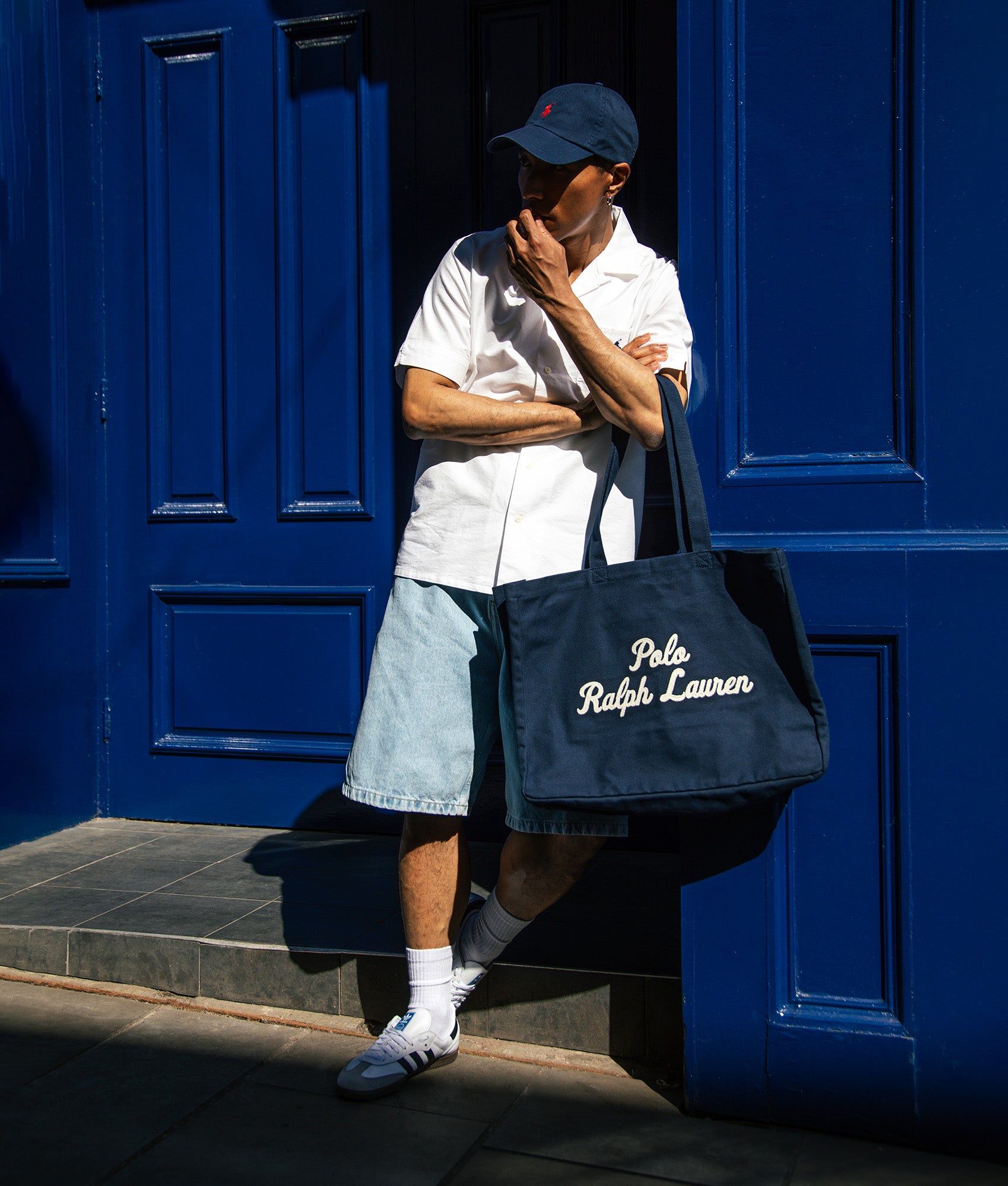 Polo Ralph Lauren Cotton Chino Baseball Cap in Newport Navy and Red at EQVVS Menswear. Second campaign shot.