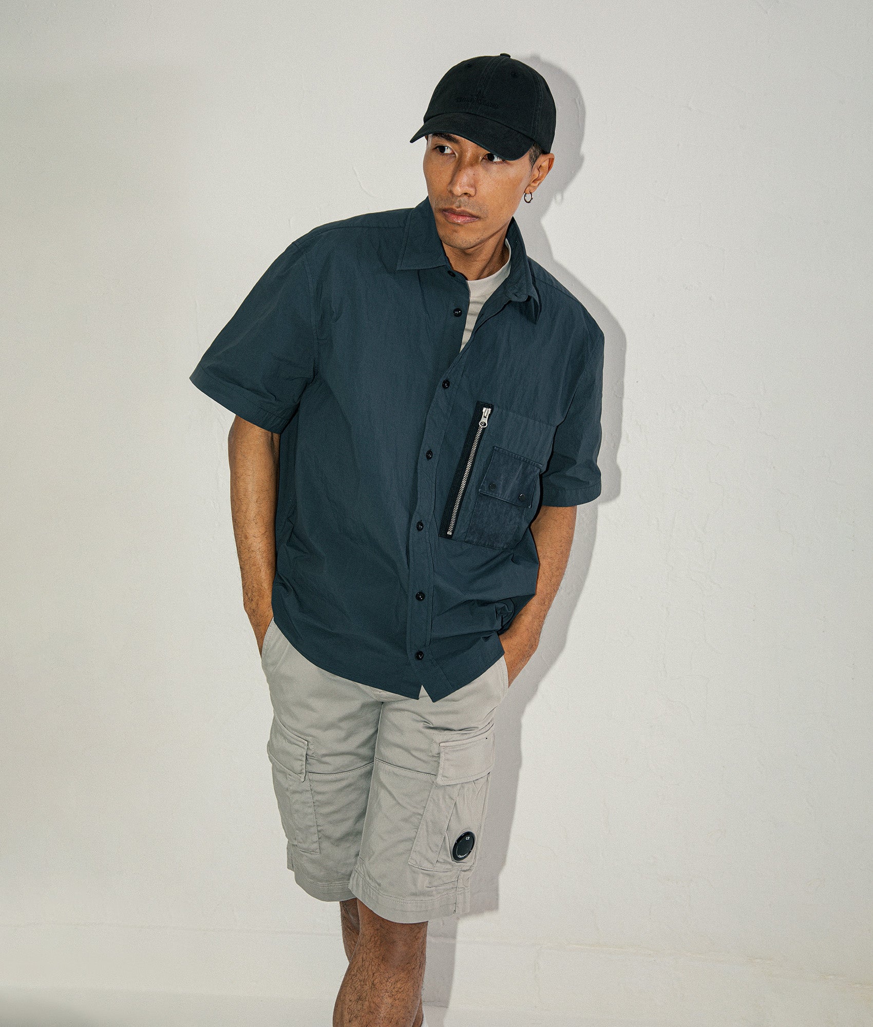 Ten c Garment Dyed Tactel Short Sleeve Shirt in Carbon Grey at EQVVS Menswear. Campaign shot.