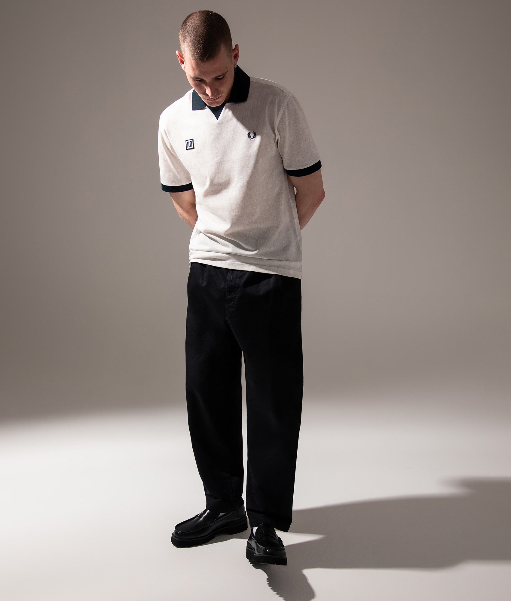 Fred Perry Meyba Printed Polo Shirt in Ecru at EQVVS Menswear. Campaign shot.
