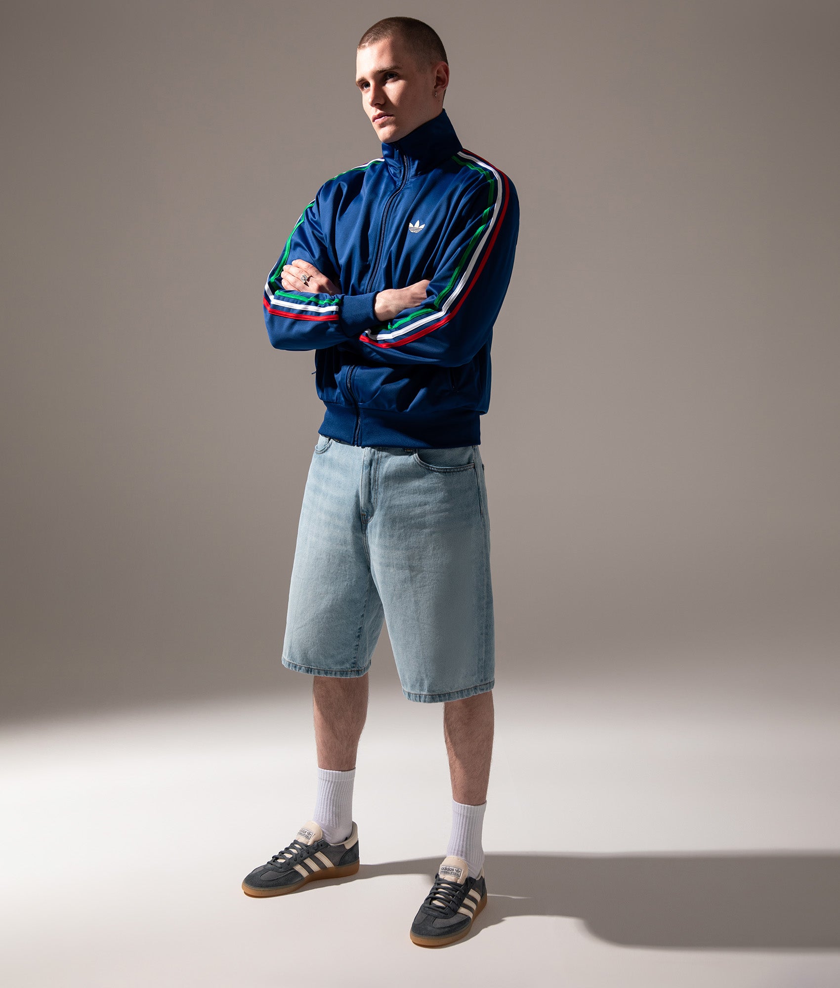 adidas Originals Firebird Track in Victory Blue, Green and White at EQVVS Menswear. Campaign shot.