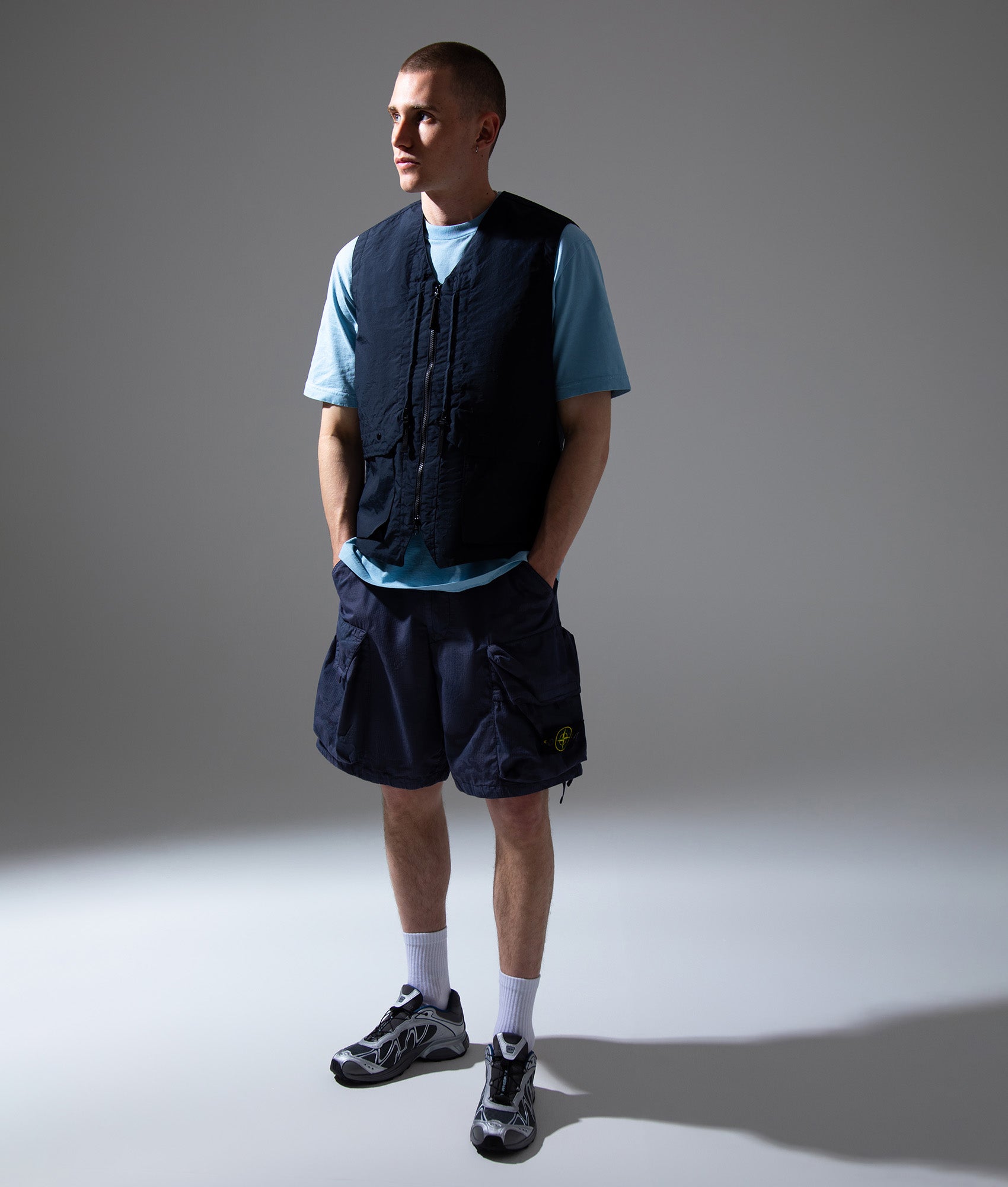 Stone Island Metal Lamina Poly Ripstop Vest in Navy Blue at EQVVS Menswear. Campaign shot.