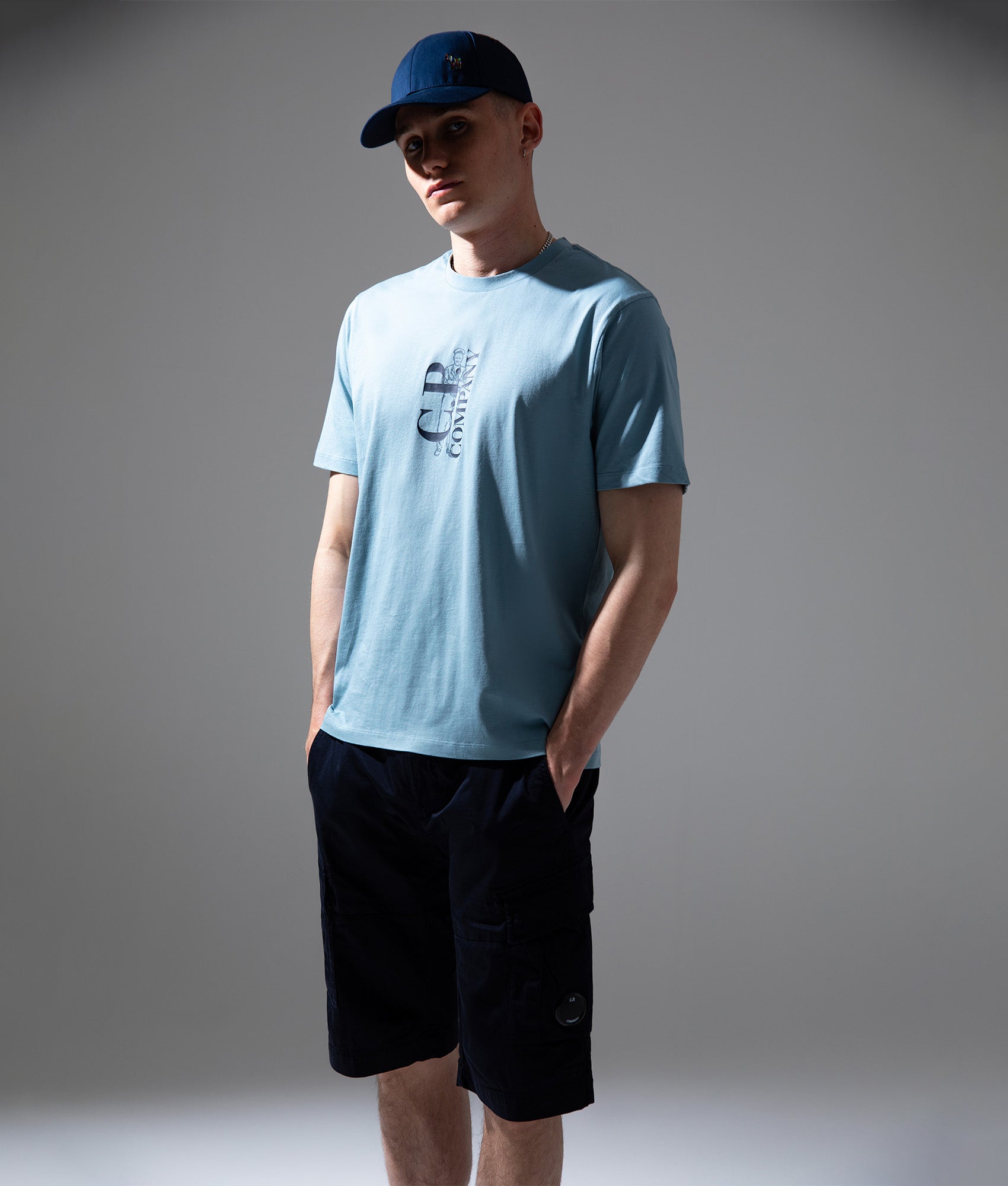 C.P. Company 30/1 Jersey Short Sleeve Printed T-Shirt in Silver Blue at EQVVS Menswear. Campaign shot.