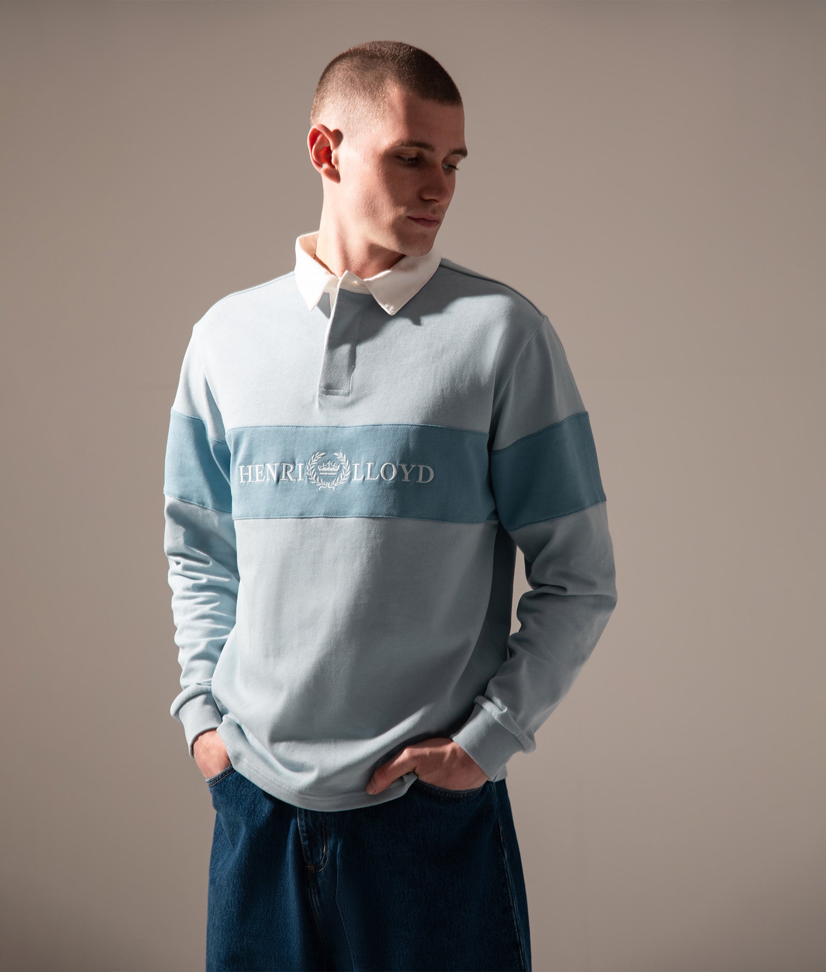 Henri-Lloyd Voyager Rugby Shirt in Fog Blue at EQVVS Menswear. Campaign shot.