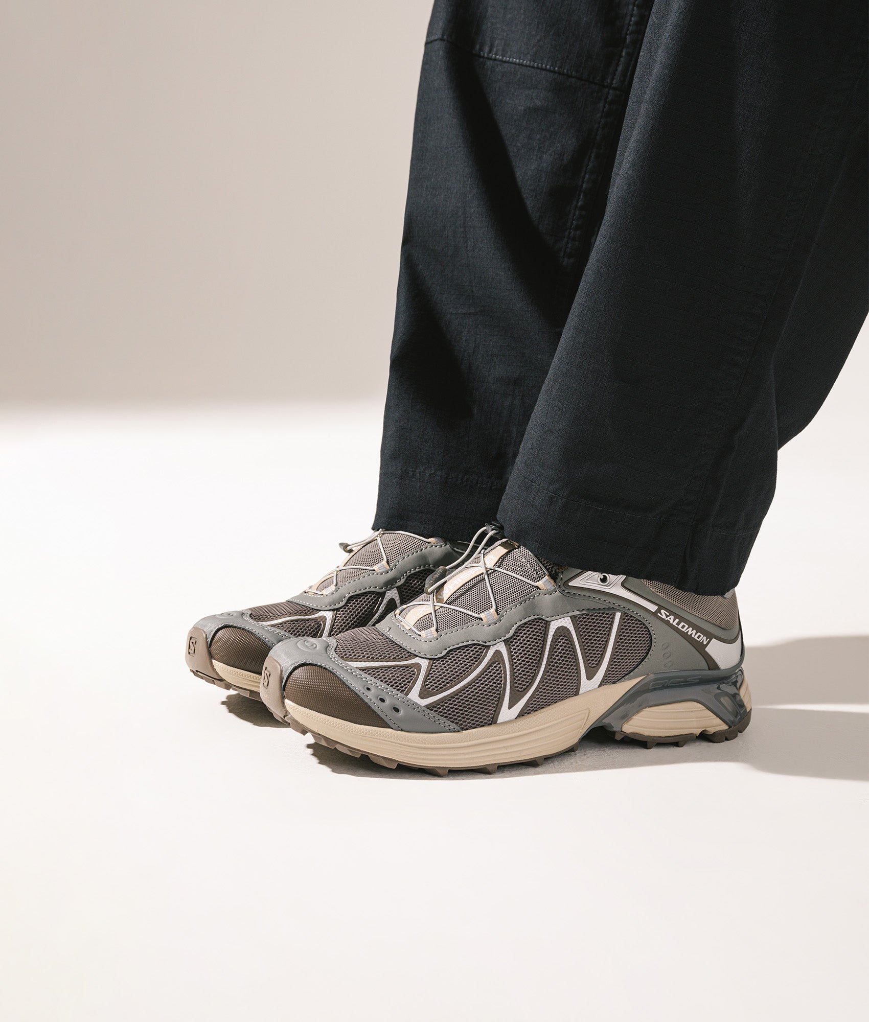 SALOMON XT-Whisper in White/Lunar Rock/FTW Silver at EQVVS Menswear. Campaign shot.