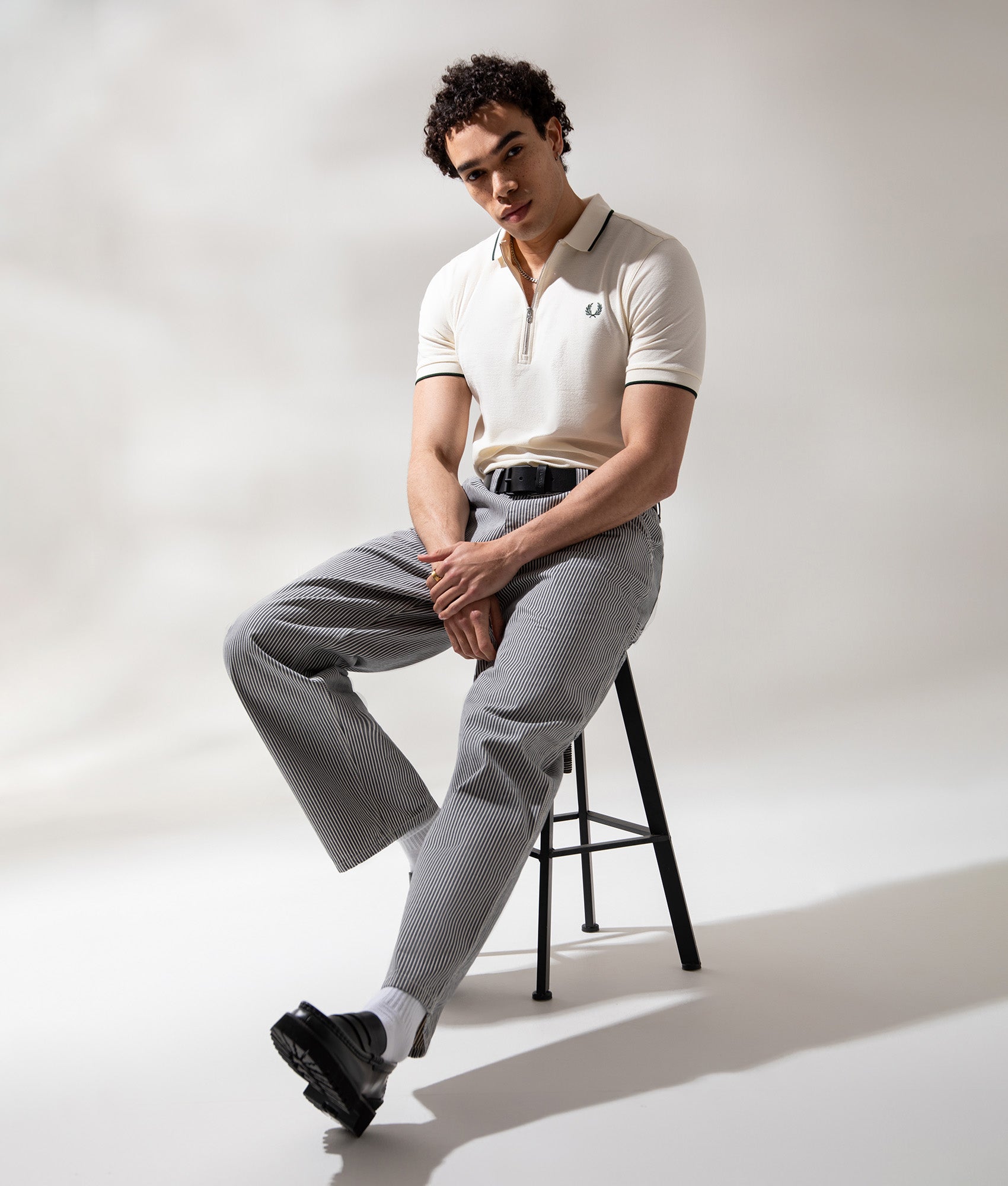 Fred Perry Crepe Piqué Polo Shirt in Ecru at EQVVS Menswear. Campaign shot.