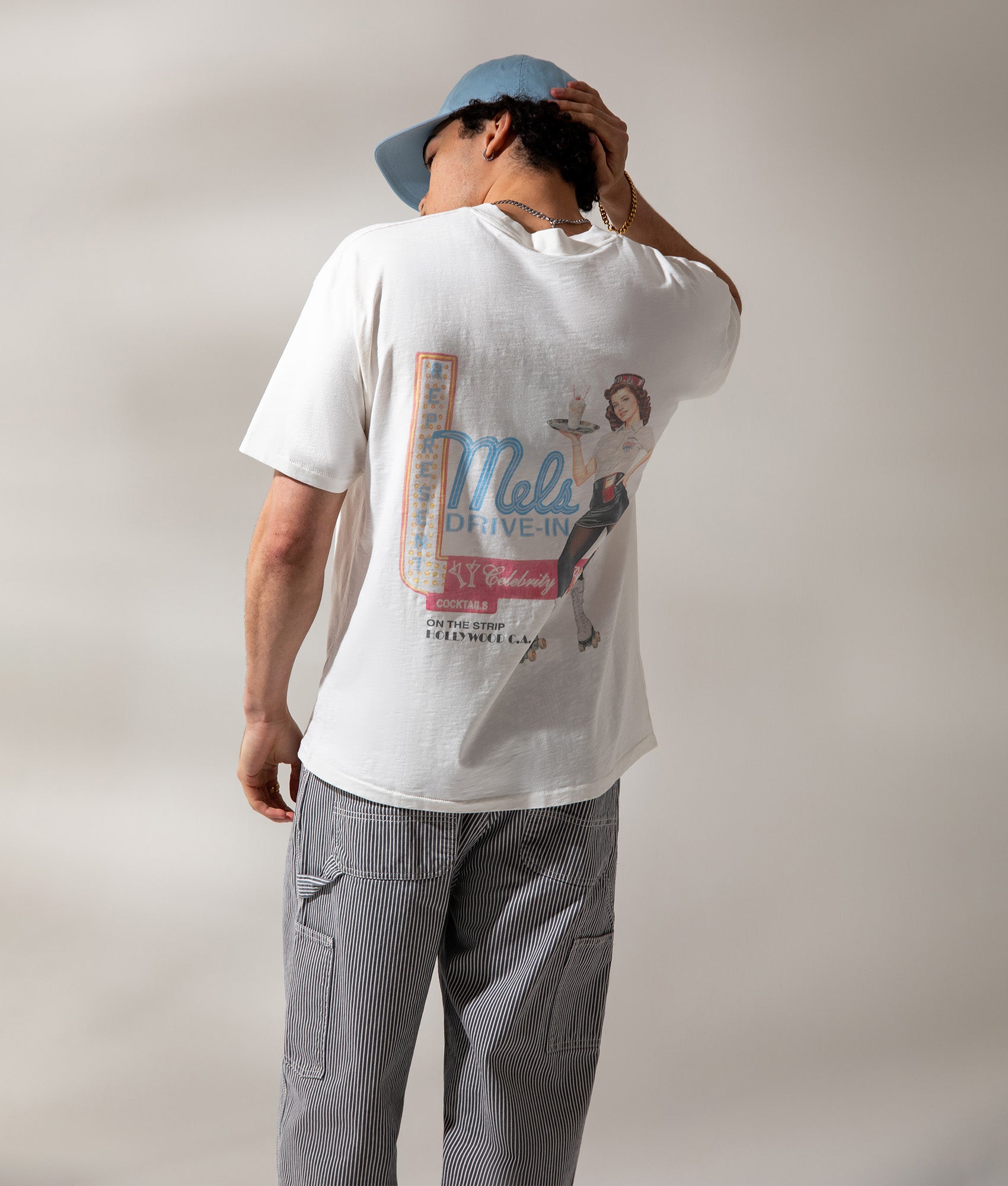 REPRESENT Mel's Diner T-Shirt in Flat White at EQVVS Menswear. Campaign shot.