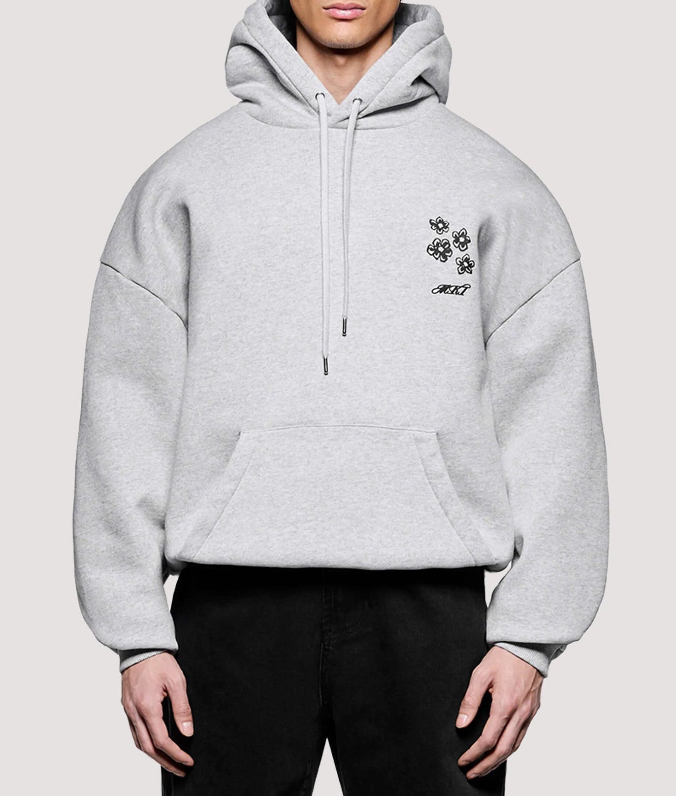 MKI MIYUKI ZOKU Box Fit Hibiscus Hoodie in Grey at EQVVS Menswear. Model front shot.