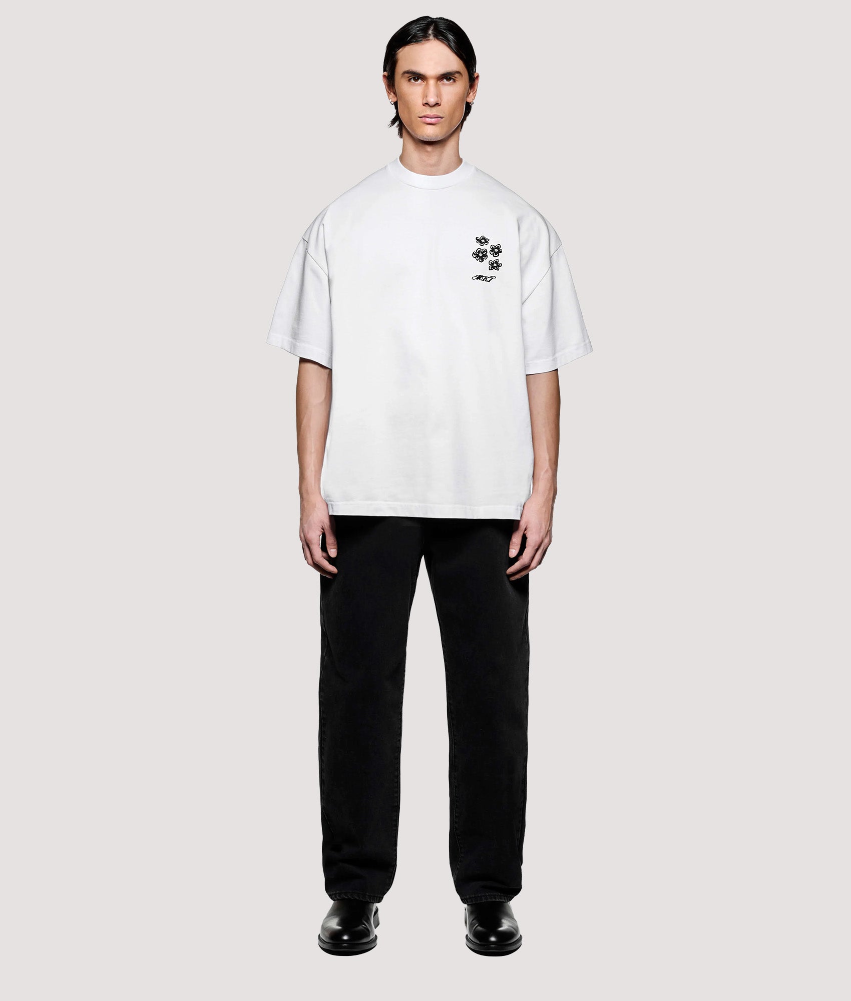 MKI MIYUKI ZOKU Box Fit Hibiscus T-Shirt in White at EQVVS Menswear. Model full front shot.
