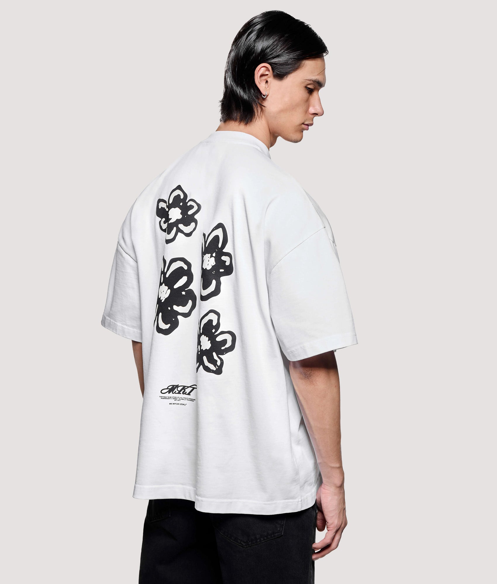 MKI MIYUKI ZOKU Box Fit Hibiscus T-Shirt in White at EQVVS Menswear. Model Back shot.