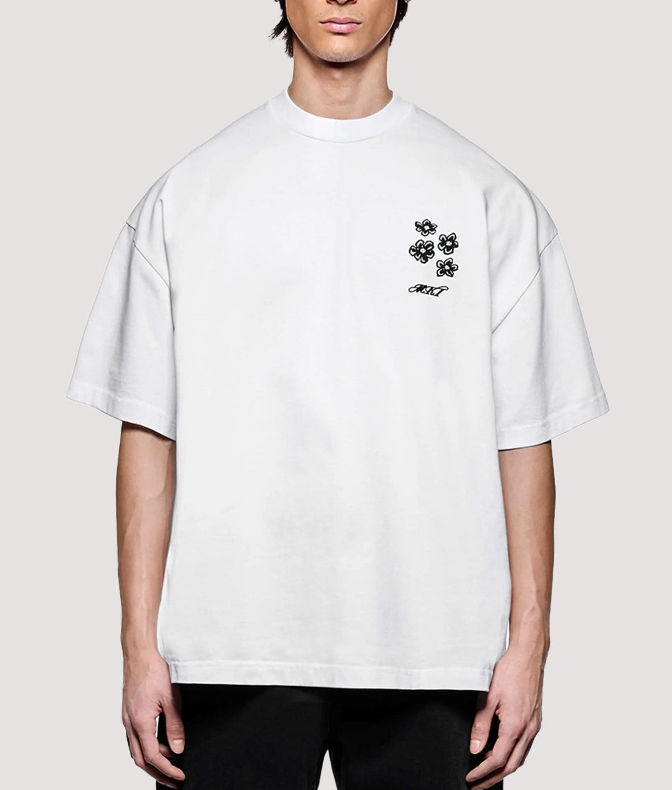 MKI MIYUKI ZOKU Box Fit Hibiscus T-Shirt in White at EQVVS Menswear. Model front shot.