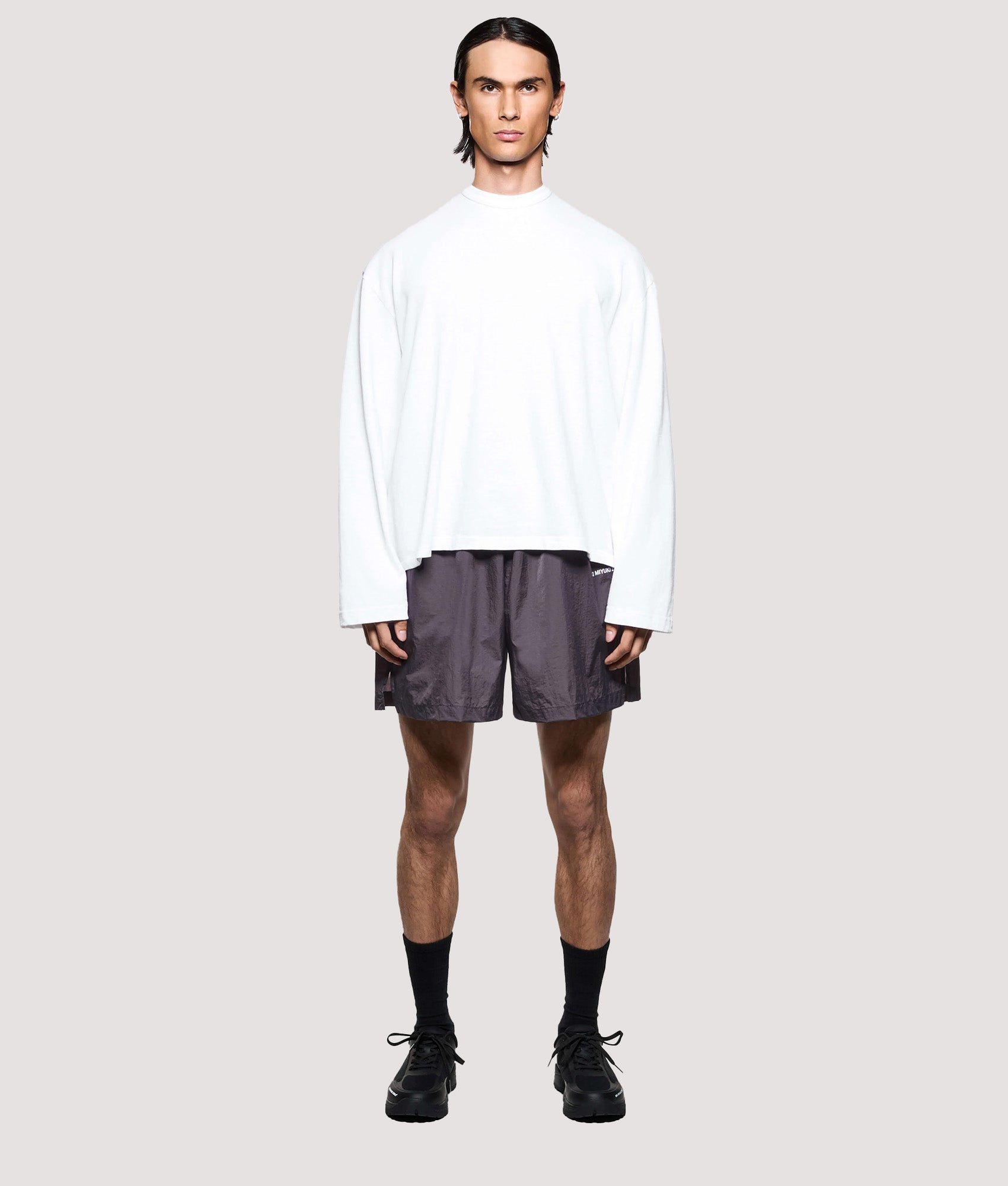 MKI MIYUKI ZOKU Relaxed Fit Hyperlight Wind Shorts in Raisin at EQVVS Menswear. Model full front shot.
