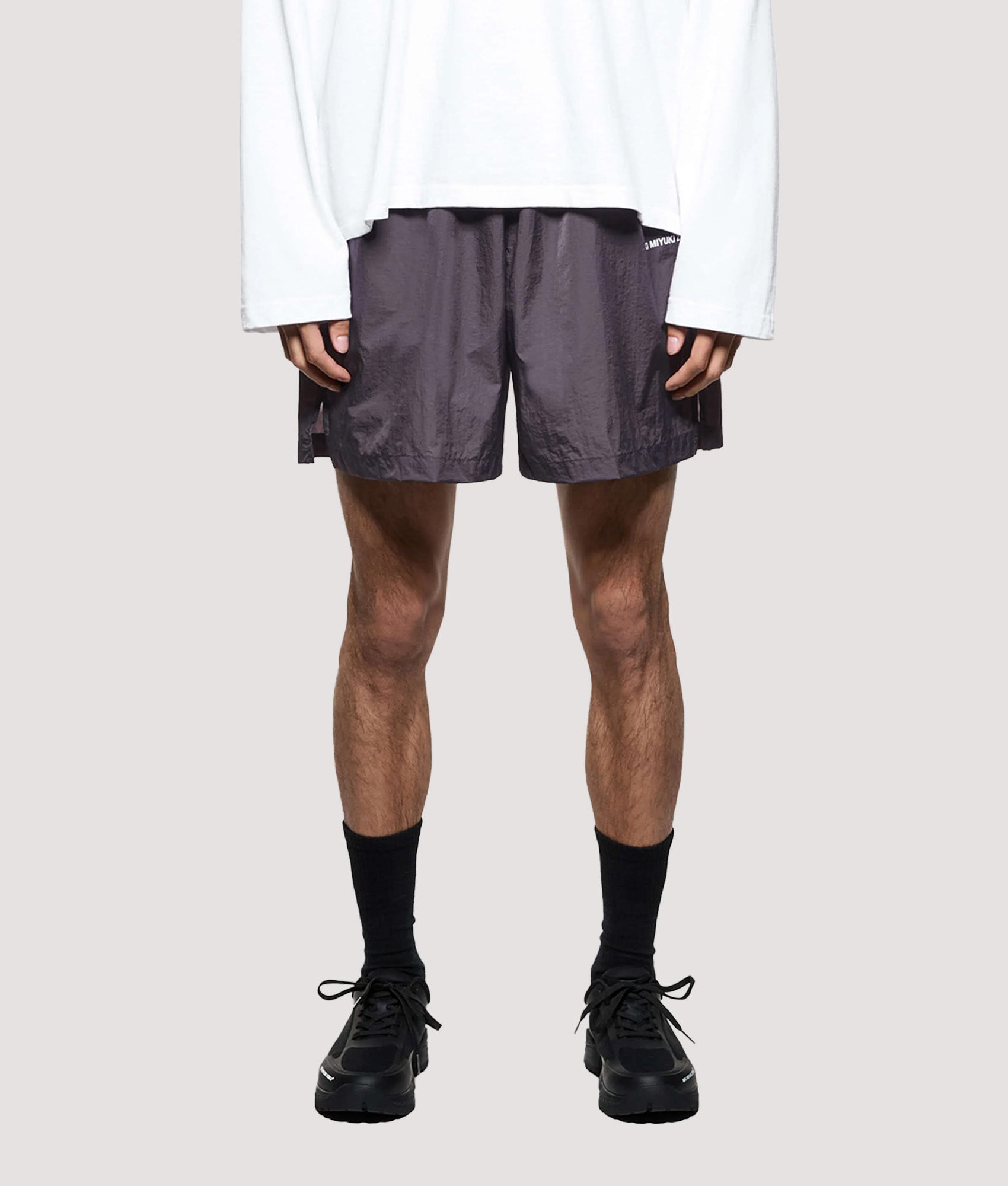 MKI MIYUKI ZOKU Relaxed Fit Hyperlight Wind Shorts in Raisin at EQVVS Menswear. Model front shot.