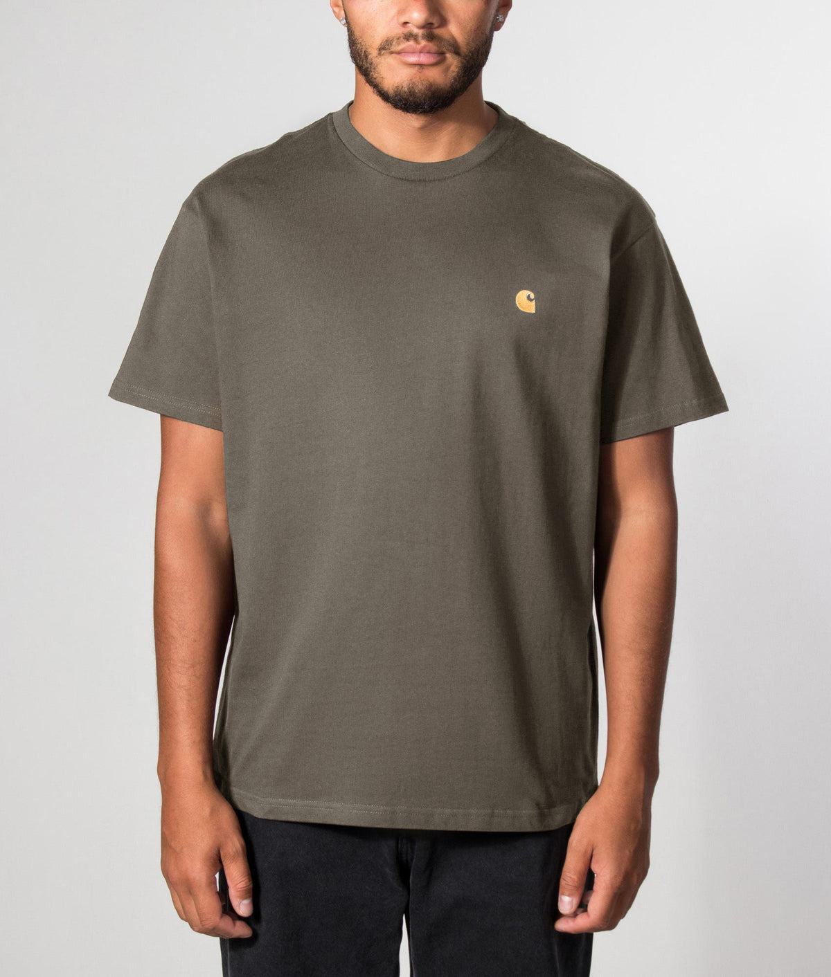 Carhartt WIP Loose Fit Chase T-Shirt in Shungite/Gold at EQVVS Menswear. Front model shot.
