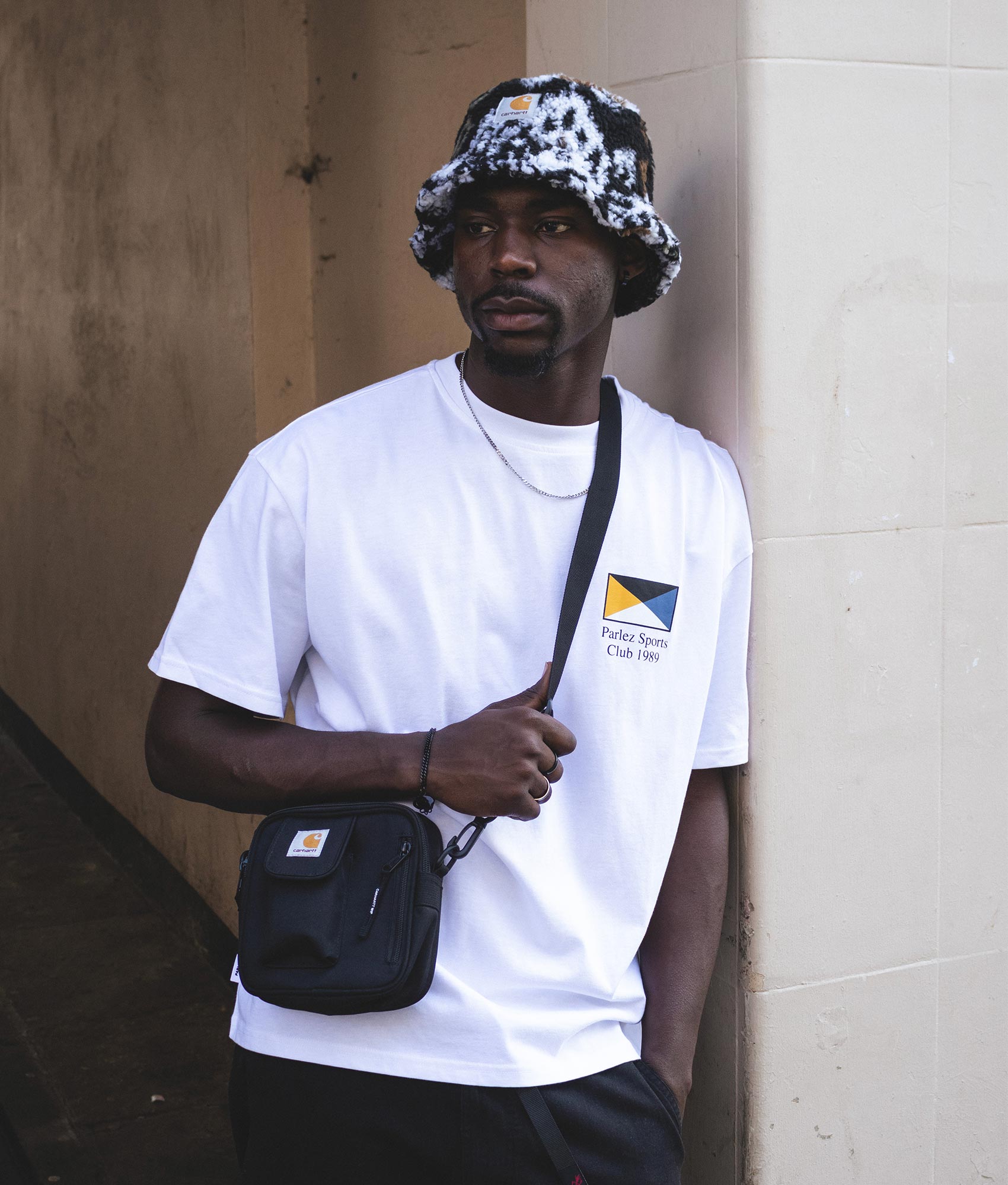 Carhartt WIP Small Essentials Bag at EQVVS Menswear. Campaign shot.