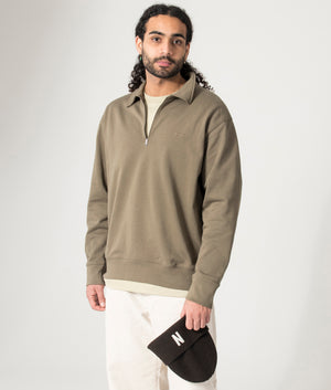 Ketel Norse Projects Quarter Zip Hoodie, Green. Model shot. 